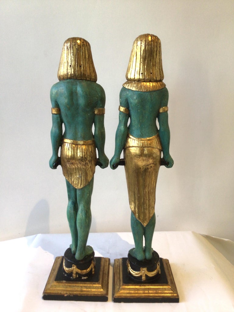 Pair Of 1940s Carved Gilt Wood Male And Female Egyptian Figures For