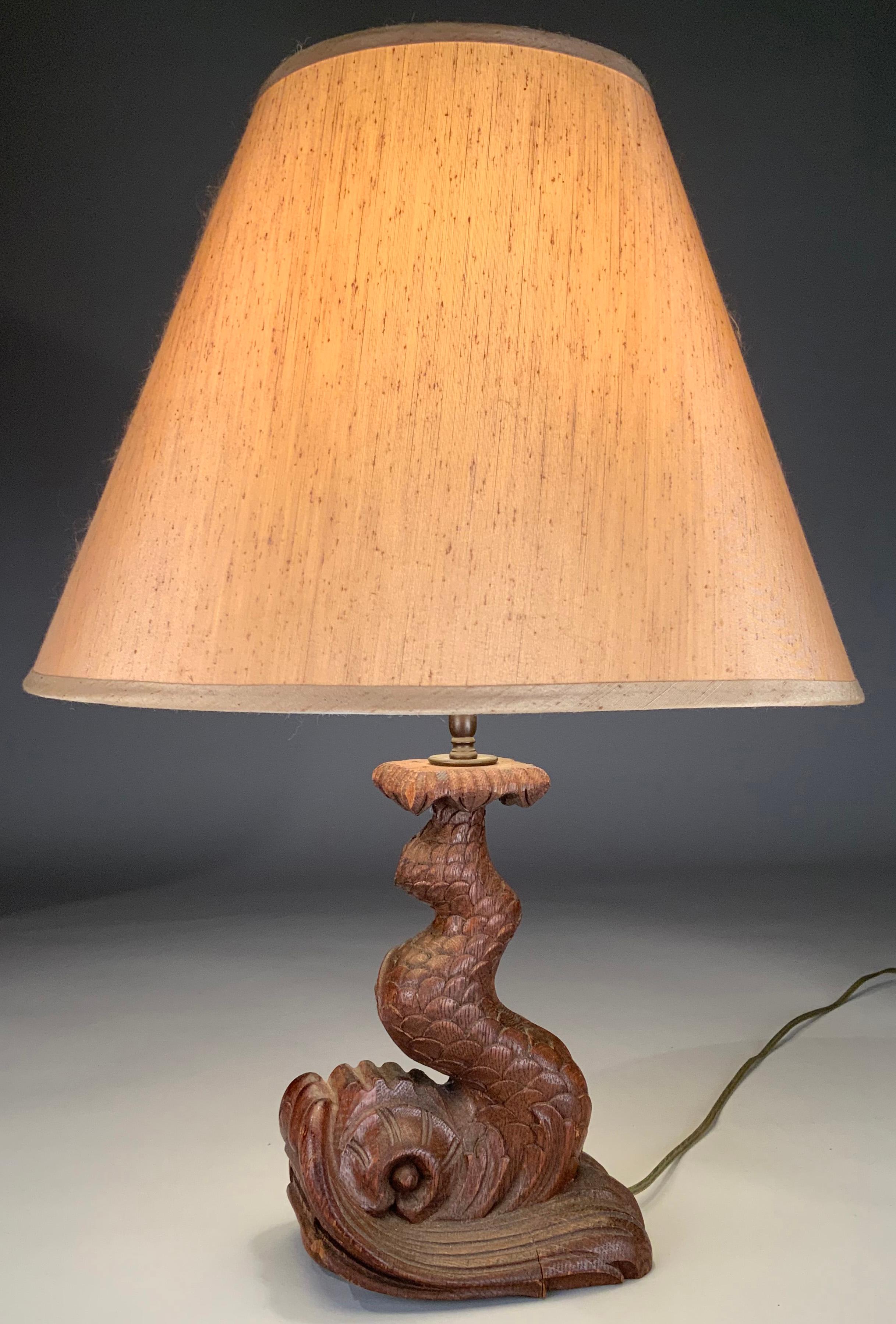 A pair of beautiful antique 1940's carved wood lamps in the form of Koi Fish. Amazing carving and scale and details - with the tails curving up towards the top of the bases. shades not included. in good antique condition with age expected wear and a