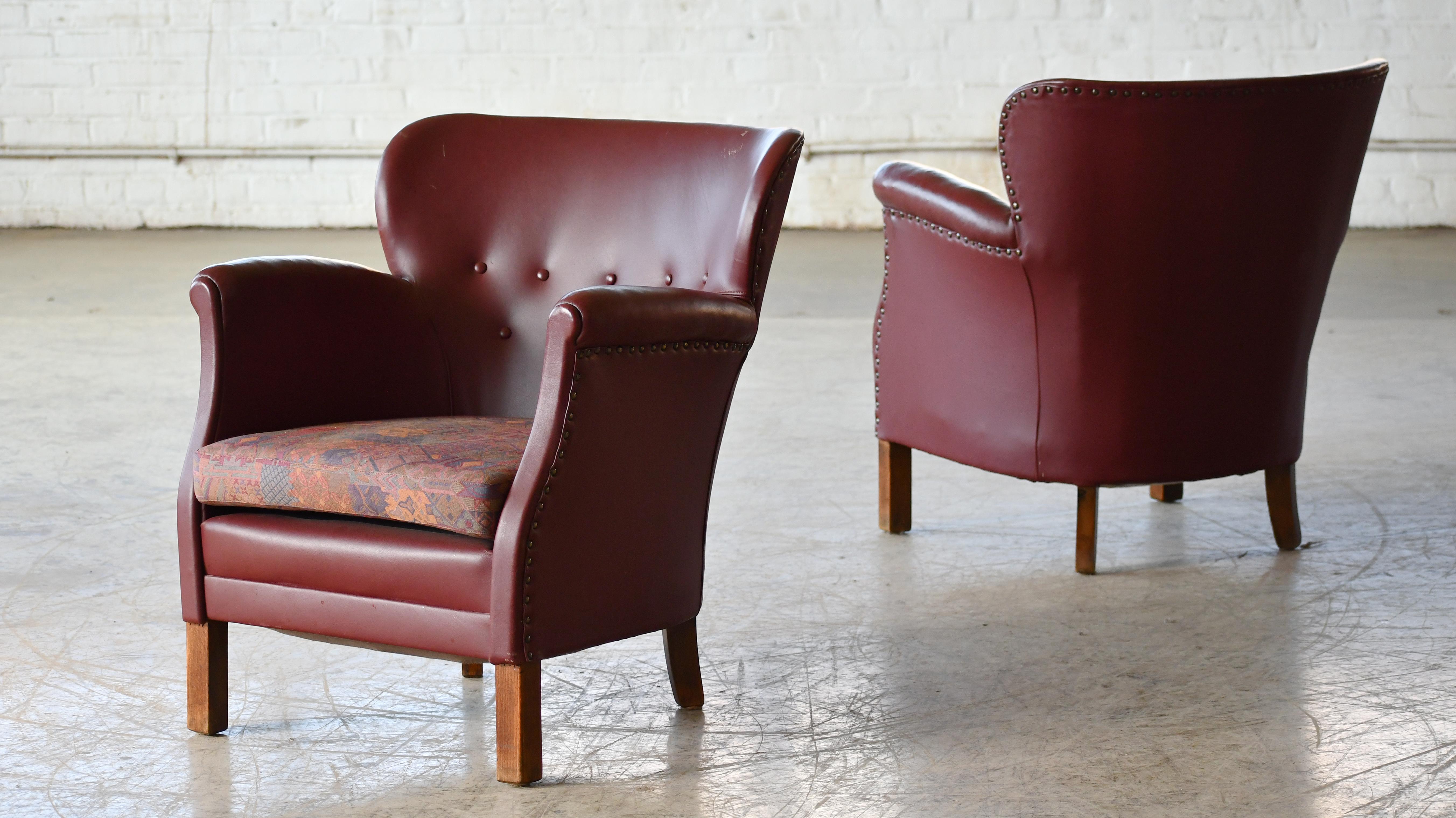 Charming pair of small scale Danish club chairs made around the 1930's to 1940's. The Danes called these smaller type chairs for 