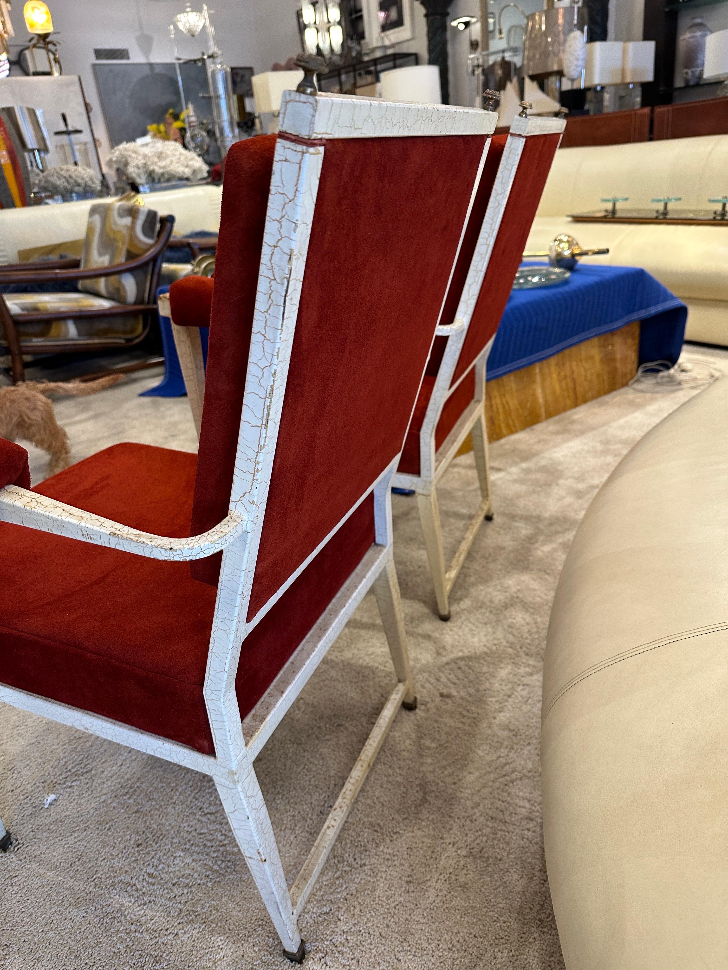 These French armchairs have the original crackled paint and fleurette accents and sabots, they have been reupholstered with an amazingly soft and rich rust tone suede leather.  THIS ITEM IS LOCATED AND WILL SHIP FROM OUR MIAMI, FLORIDA SHOWROOM.
