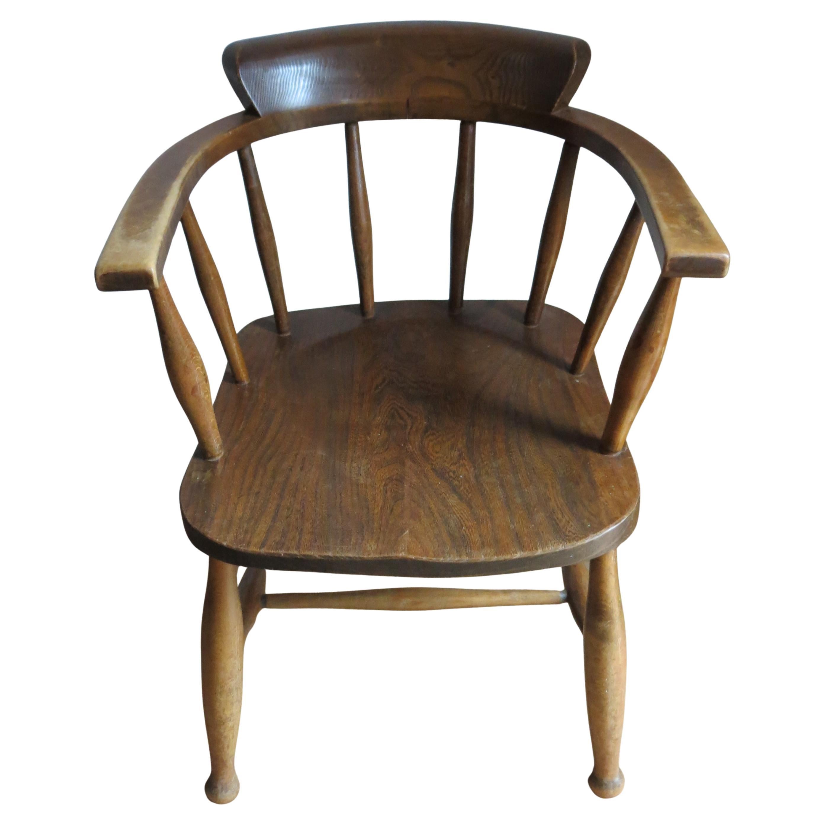 Good quality pair of Captain's or Carver chairs. 
Solid Elm seat and back and Beech legs.  One chair has Beech arms and the other has Elm arms.. Date from the 1940s
Very nice turned rails and shaped seat, good solid quality chairs. One chair is