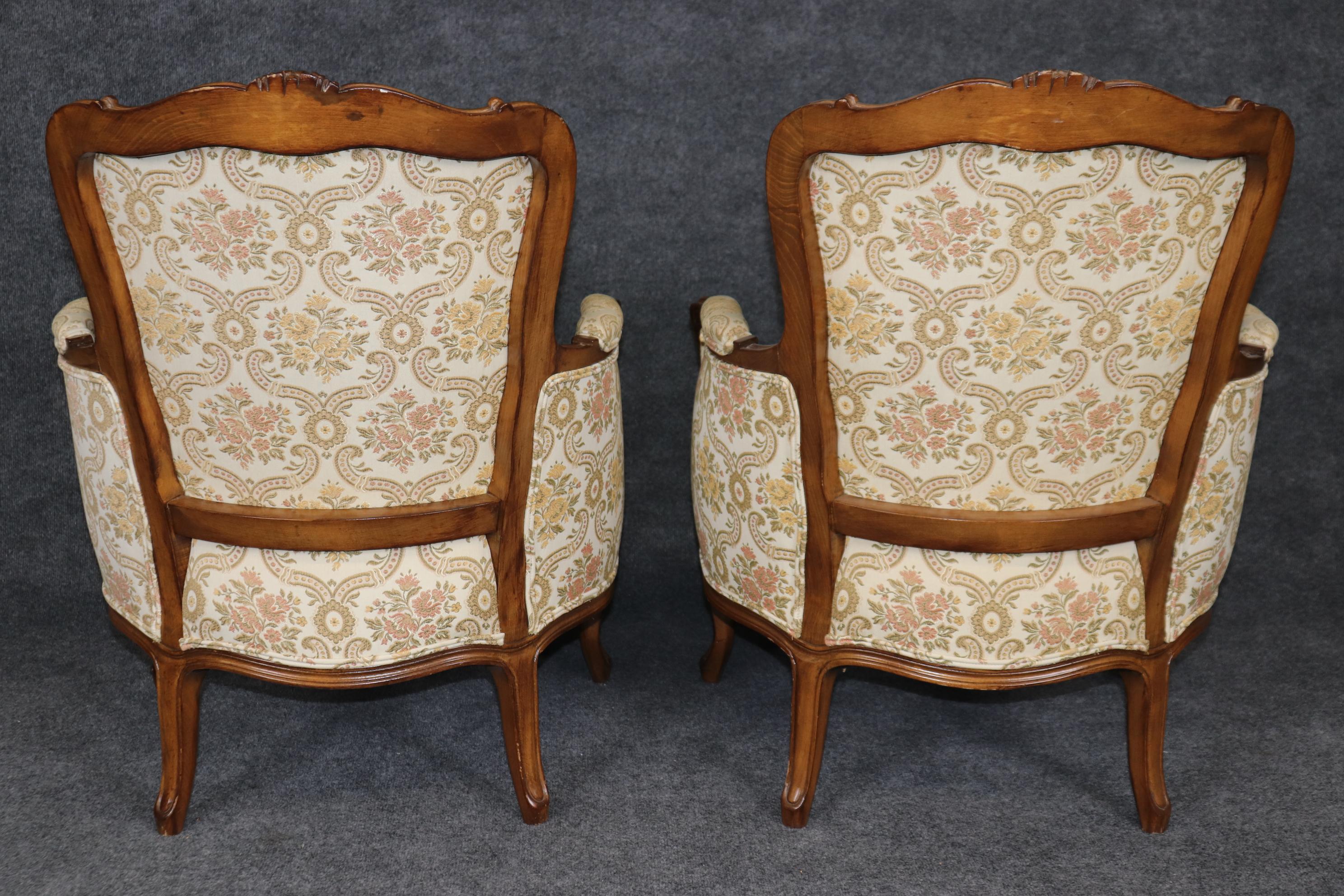 Mid-20th Century Pair of 1940s era French Walnut Carved Louis XV Style Bergere Lounge Chairs For Sale