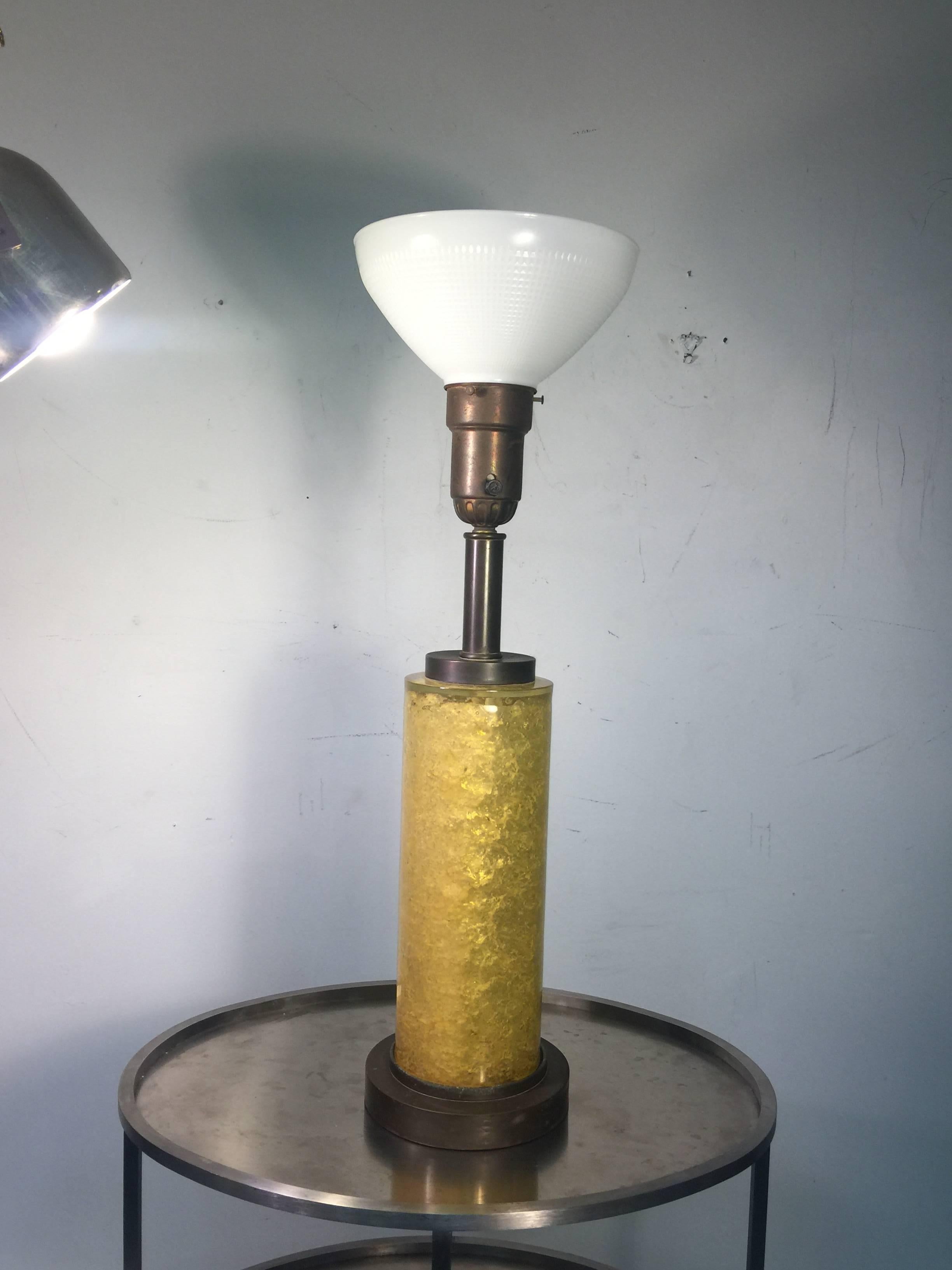 Great pair of yellow hued fractured resin lamps with brass base and fittings made in the 1940s. Fitted with a mogul light fixture and white glass fitter shades these are in the manner of designer Samuel Marx. The resin cylinder measures at 14 1/2