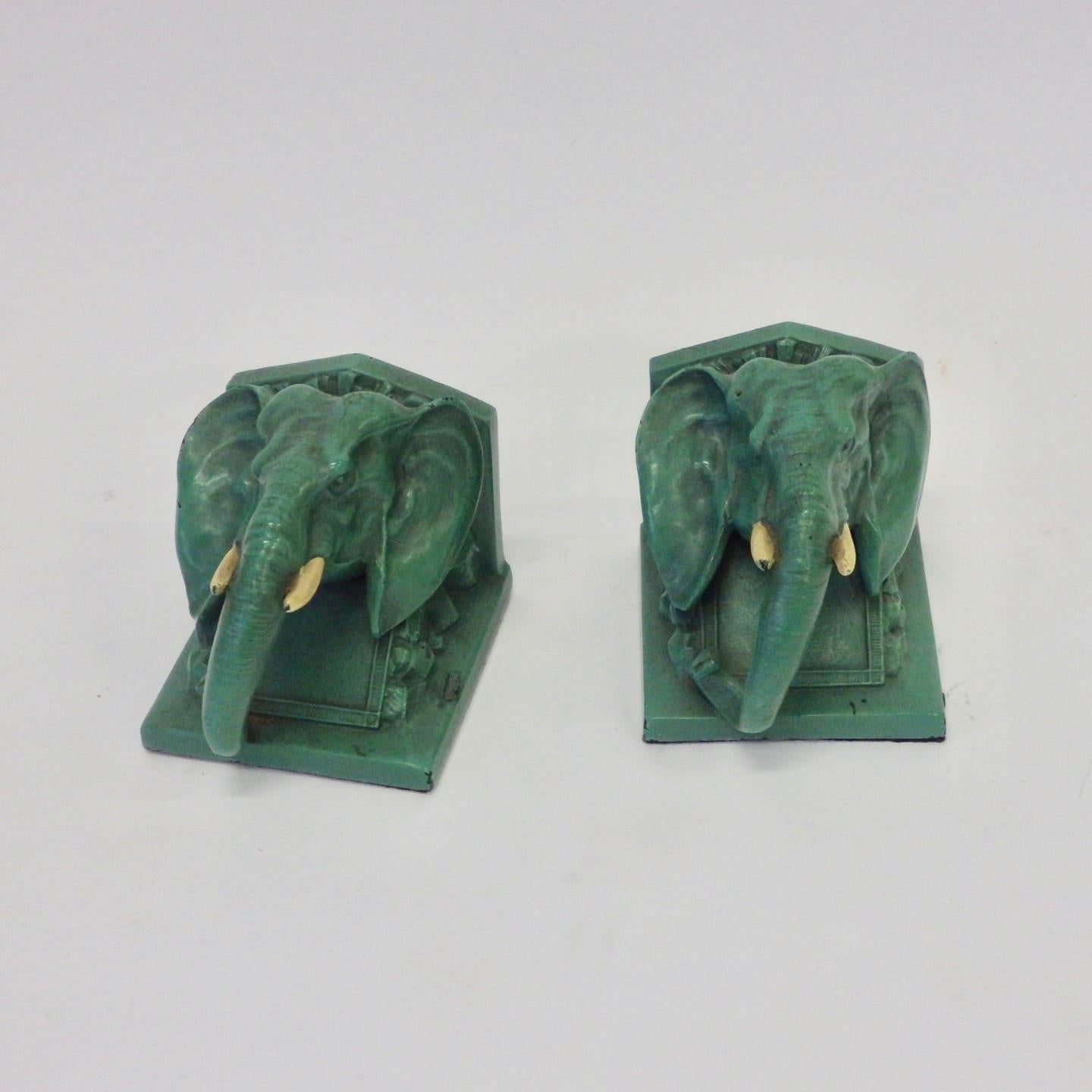 Pair of 1940s cast elephant bookends in original green paint.