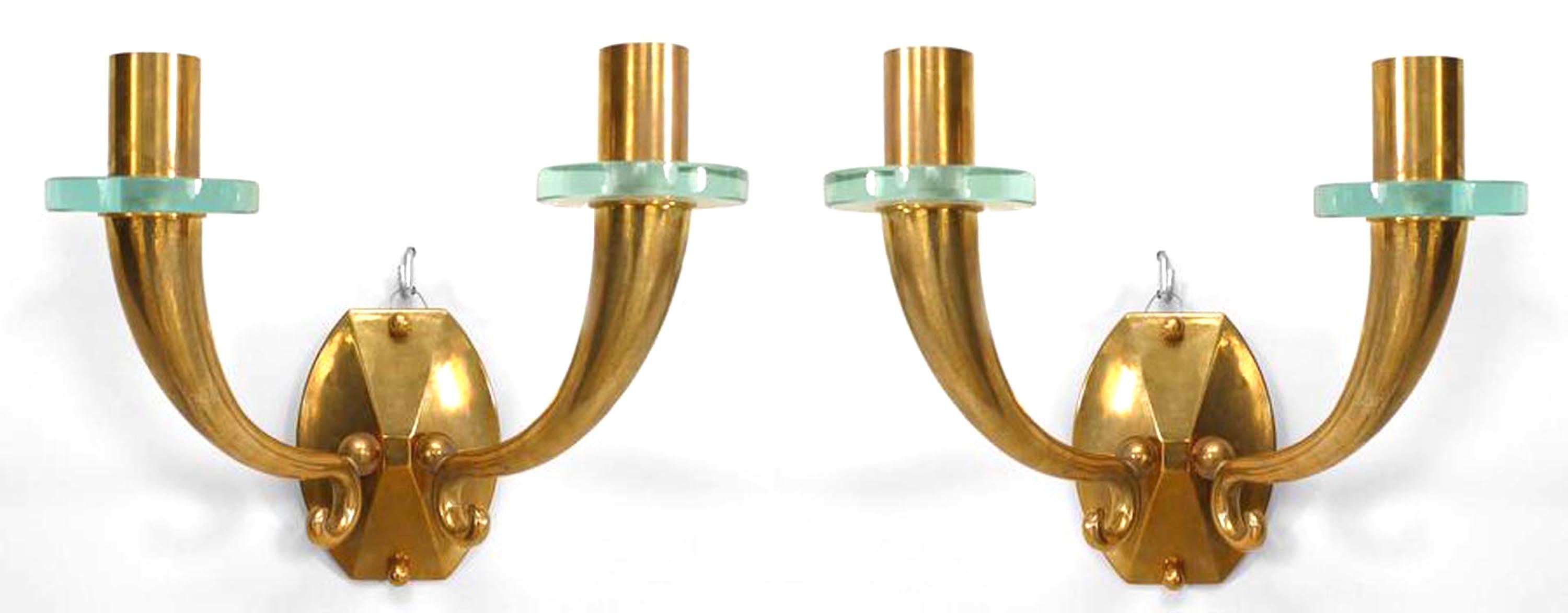 Pair of French Mid-Century (1940's) bronze wall sconces with 2 scroll and cornucopia design arms with a round glass bobeche and supported by a shaped backplate. (PRICED AS Pair)
