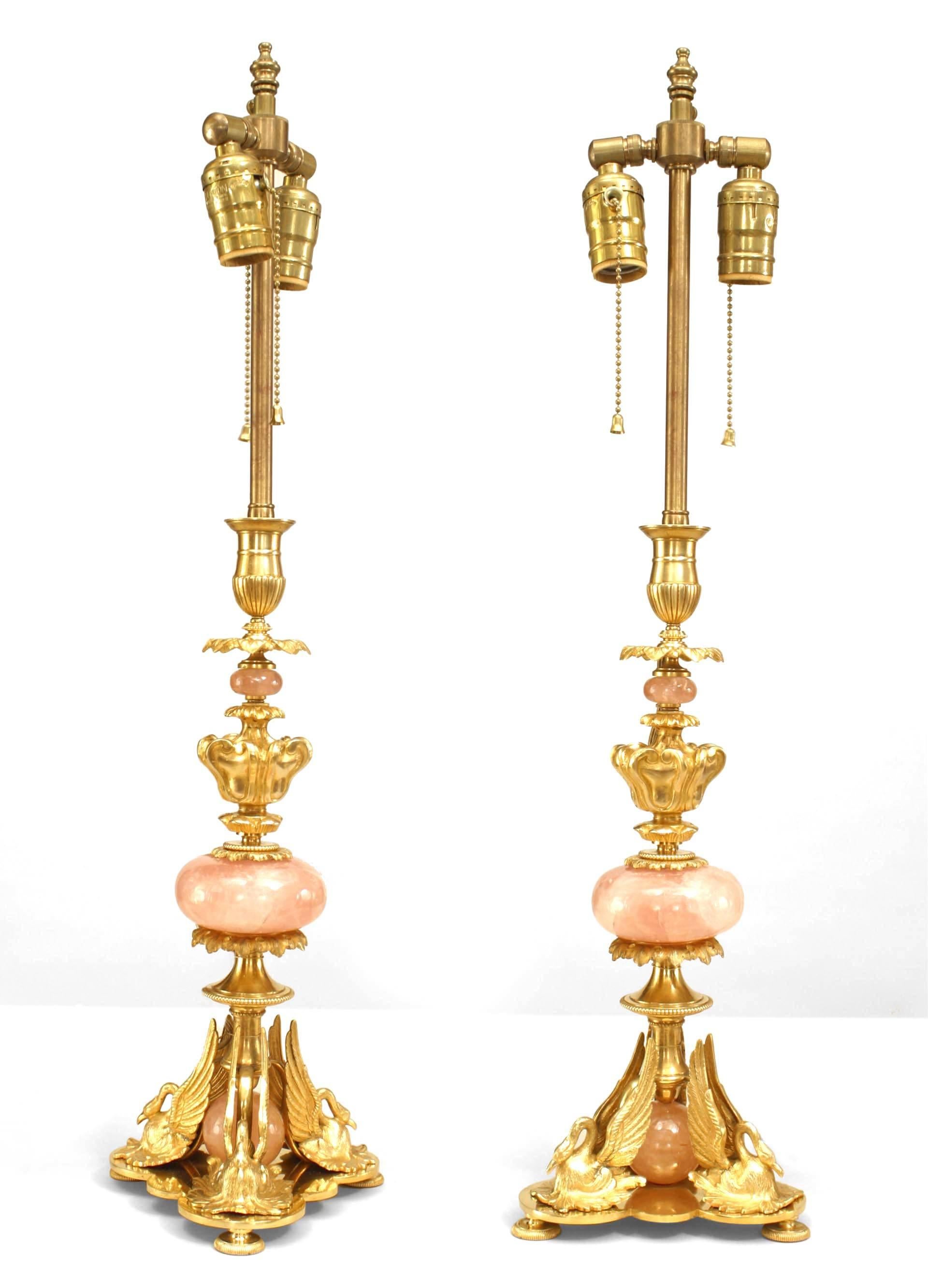 Pair of French Empire style (1940s) gilt bronze and rose quartz table lamps with 3 swans at base (PRICED AS Pair).

