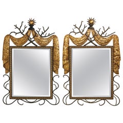 Pair of Gilbert Poillerat Style Parcel-Gilt and Black Iron Wall Mirrors