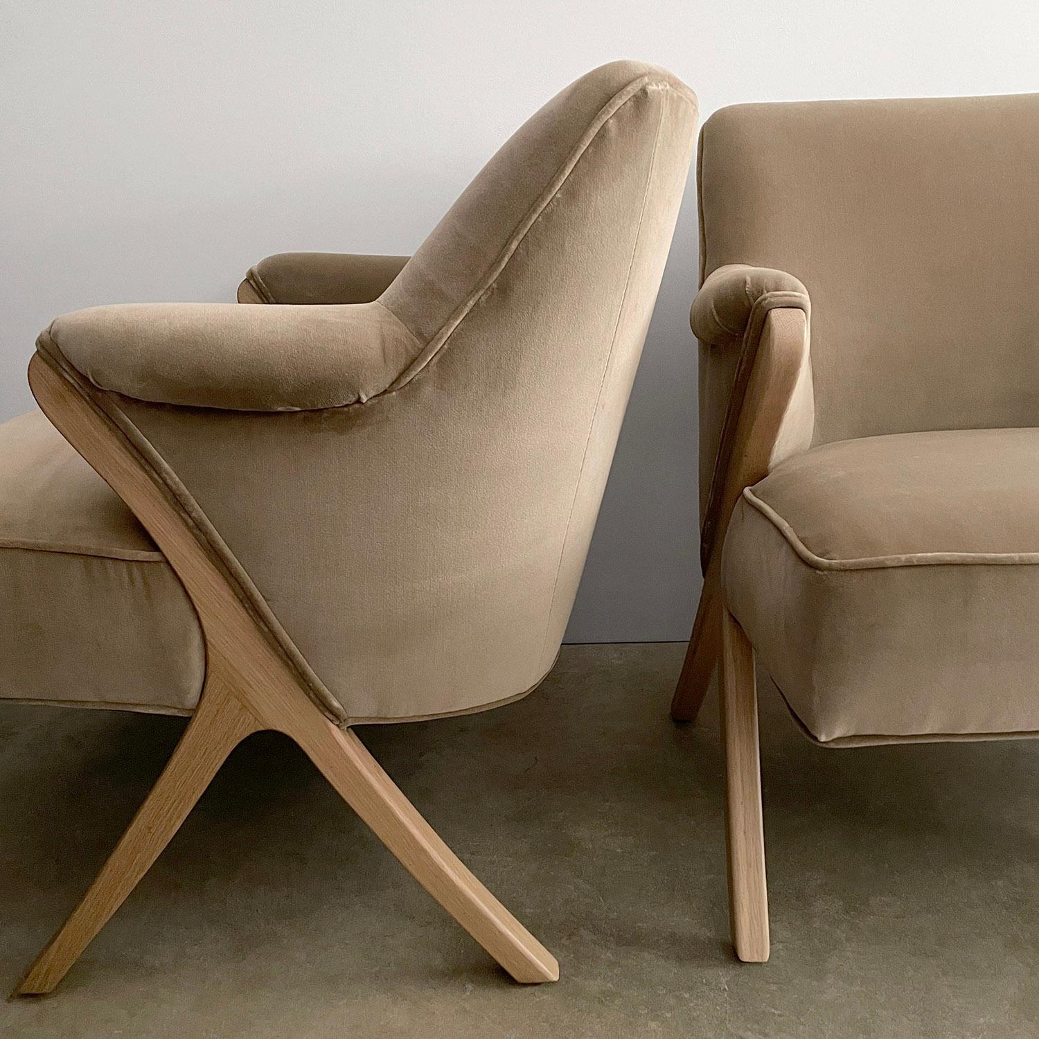 Pair of 1940s French lounge chairs
This chair is beautiful from all angles
Newly upholstered in a textured Italian velvet fabric
Beautifully sculpted splayed wishbone legs are constructed of solid white oak 
Newly refinished 
Please note - this is a