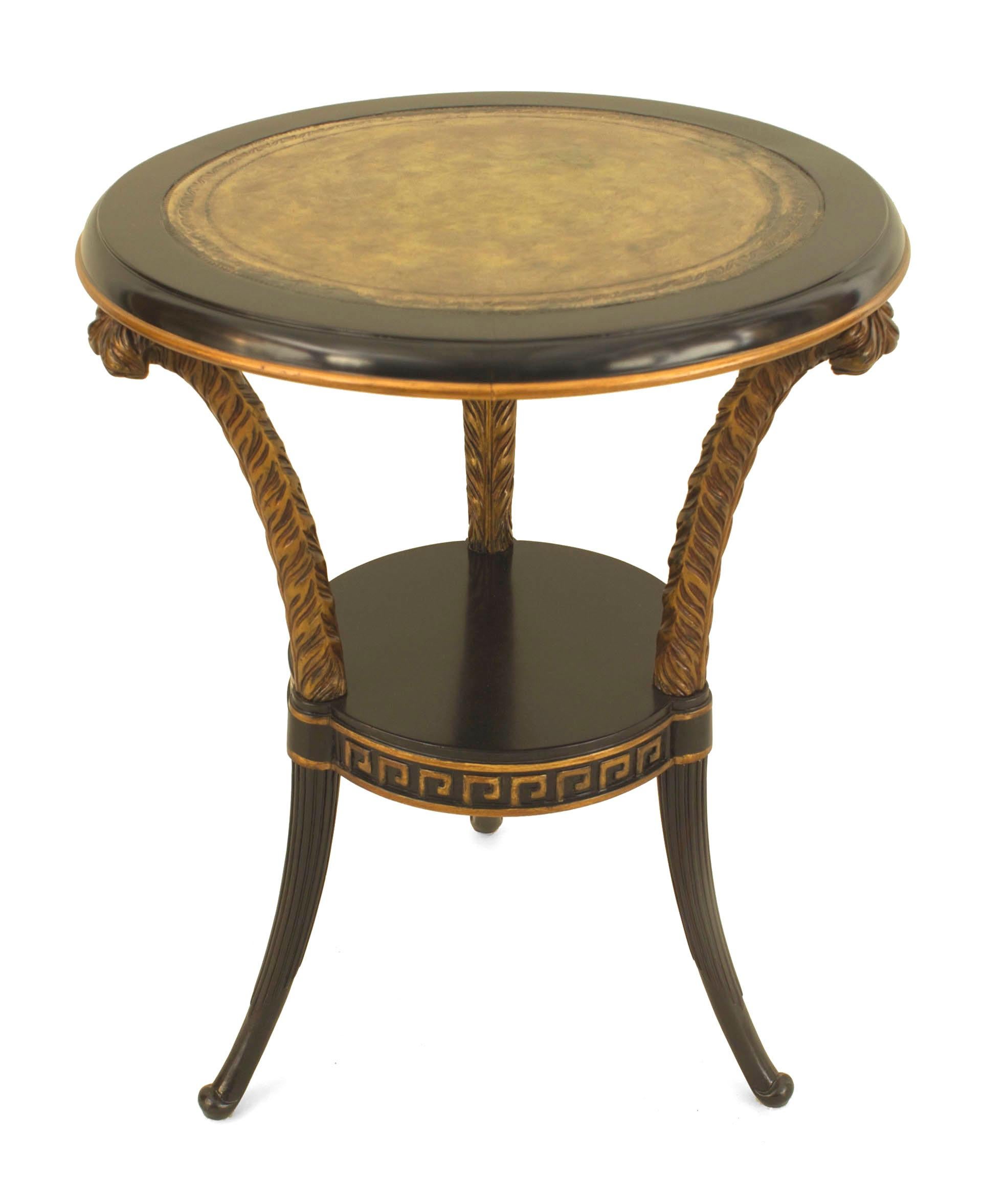 Pair of French Regency-style (1940s) ebonized round end tables with 3 plume carved leg connected by a round shelf stretcher having a Greek key design and decorated top. (Attributed to MAISON JANSEN) (PRICED AS Pair).
 