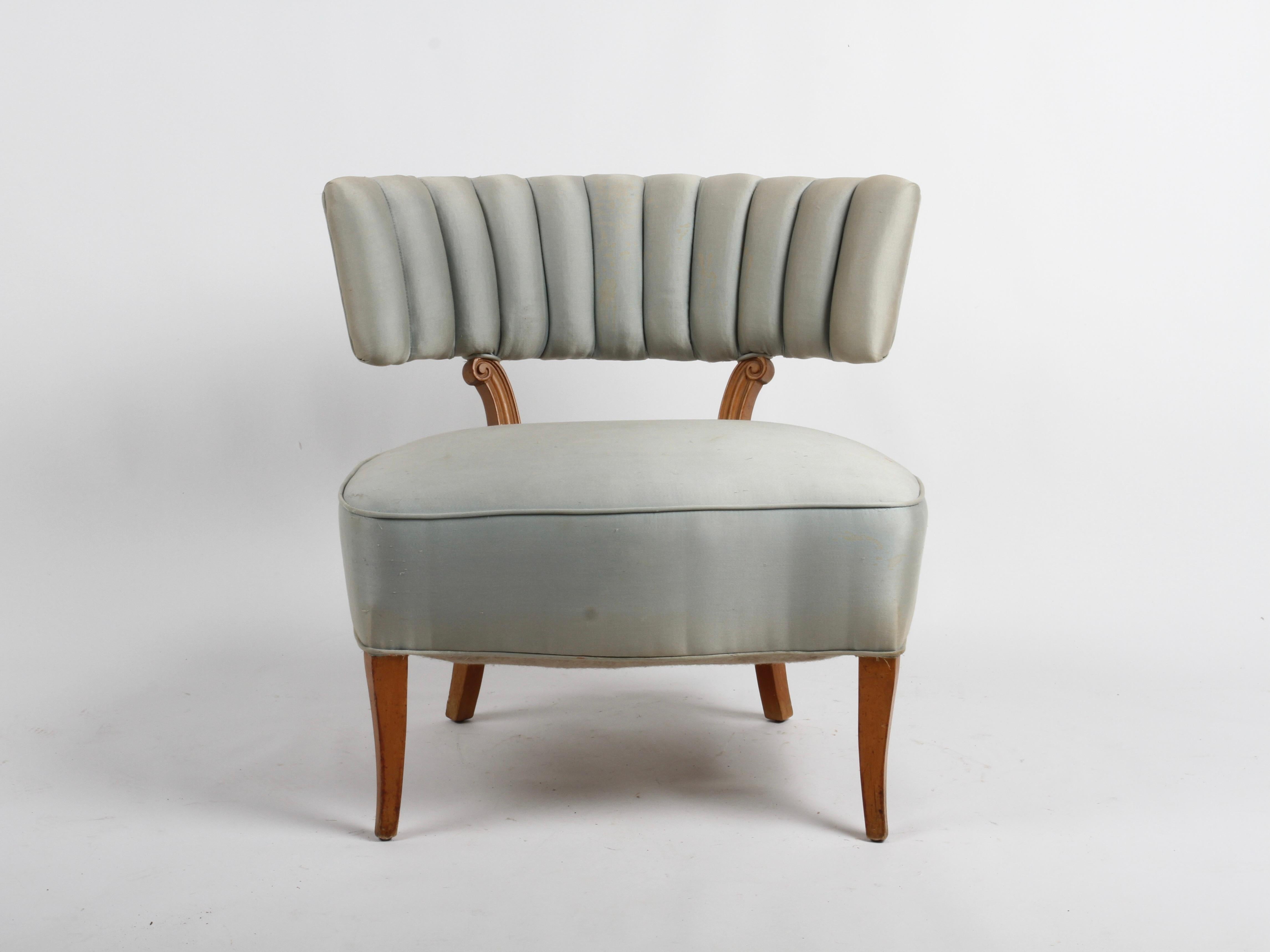 Pair of  1940s high style Lorin Jackson for Grosfeld House wide body slipper chairs with channeled backs on splayed legs. Of the Hollywood Period, these lounge chairs do have neoclassical influences in the carving of the back supports. Wide