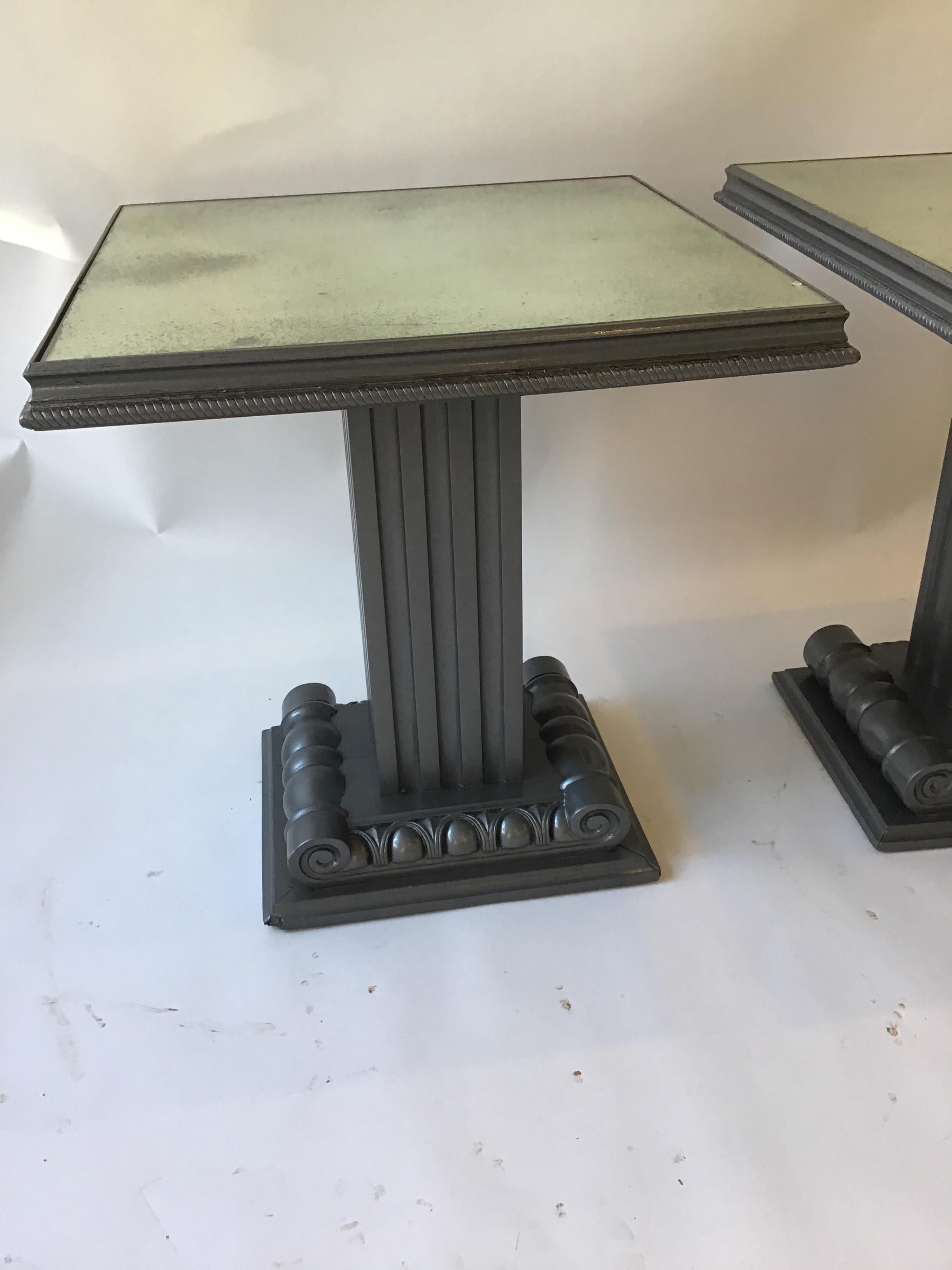 Pair of 1940s Grosfeld House column tables with mirrored tops. From an East Hampton, NY estate. Painted grey by a designer. Small chip of wood missing as shown in image 11.