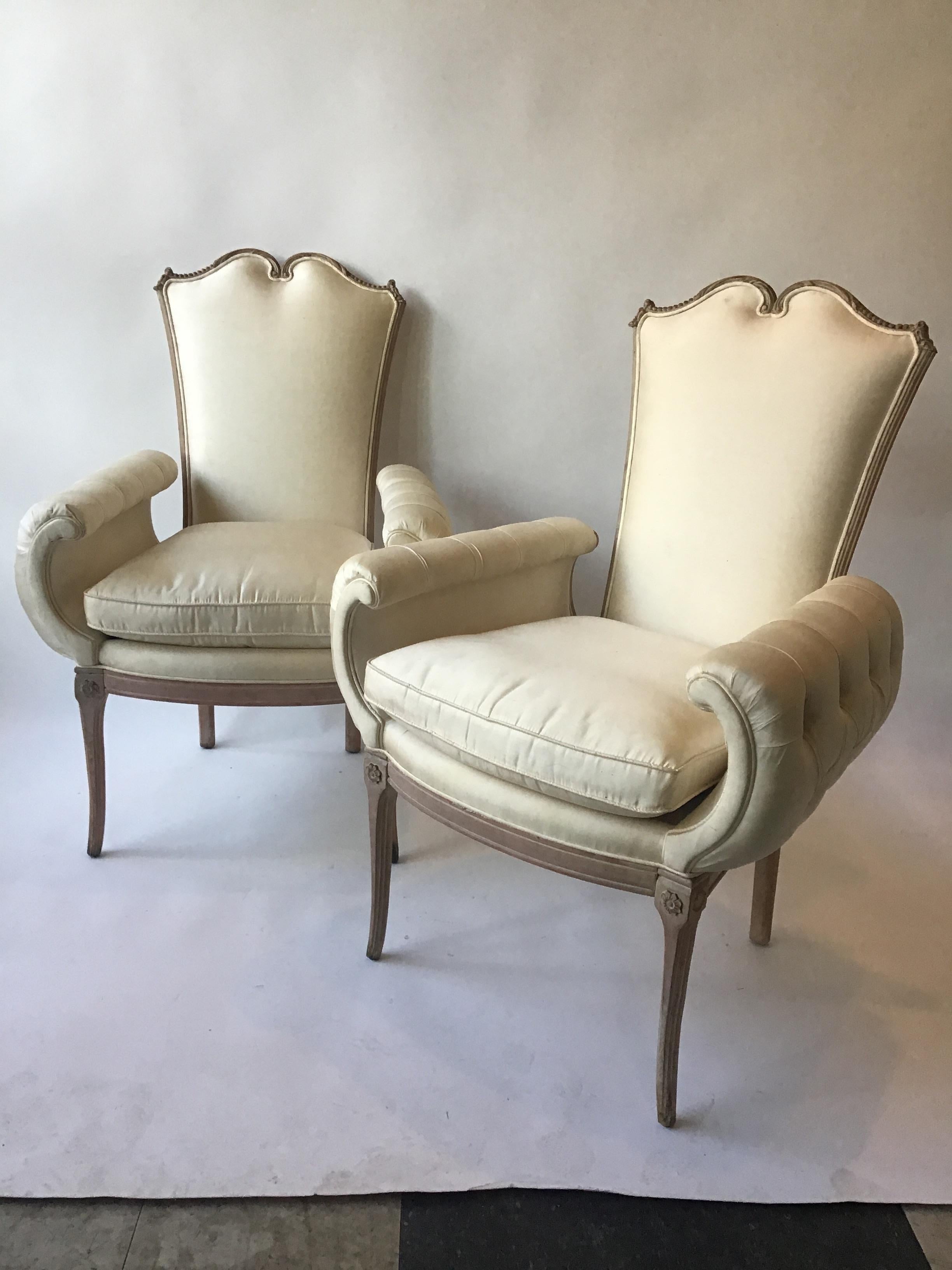 Very glam, 1940s Hollywood Regency wide, over exaggerated armchairs.