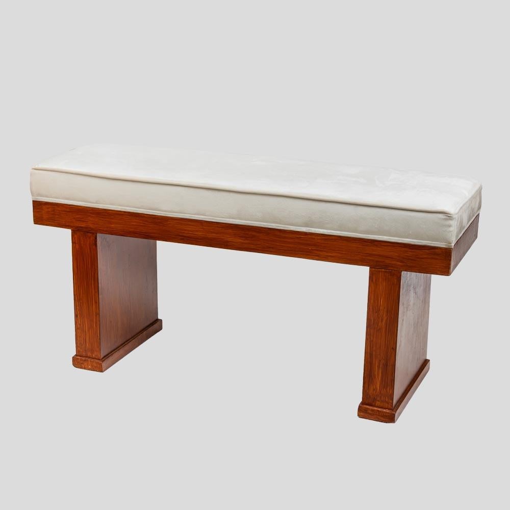 A vintage pair of elegant Benches. Italian design wooden structure with cream white cotton velvet upholstery.
The base provides sturdy support, while the upholstered white cotton velvet seat cushions provide comfort. They are a beautiful addition to