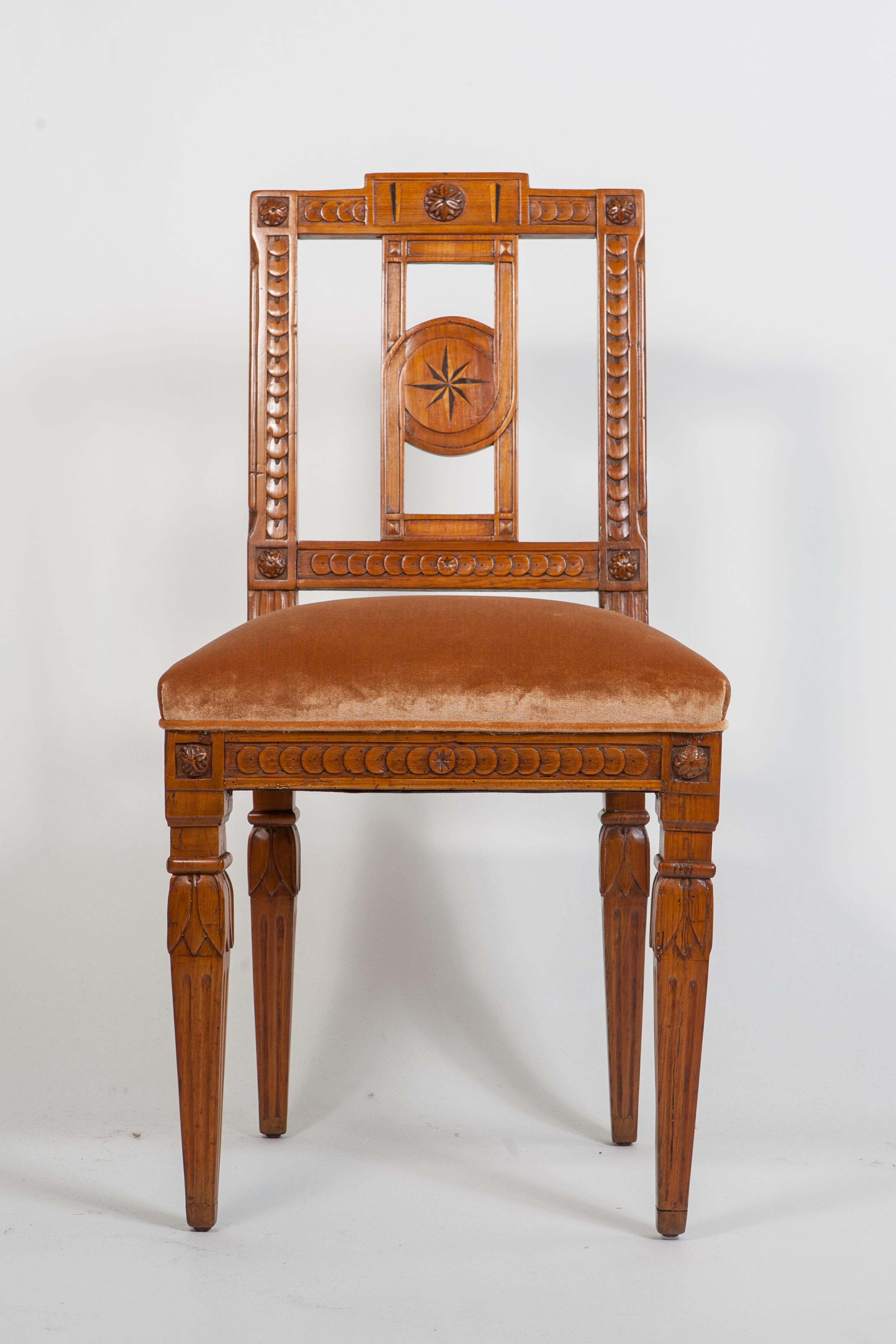 Beautiful pair of carved and inlaid fruitwood Italian neoclassical side chairs with carved wood details throughout and tapered legs. Newly upholstered in caramel silk velvet.