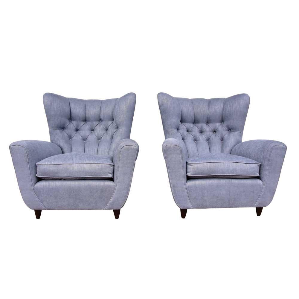 A great pair of 1940s wing armchairs, Italian design by Poalo Buffa.
Tufted back, light blue fabric upholstery tapered cone shaped dark wooden feet, completely re upholstered to contemporary standards with a respectful feel for its original