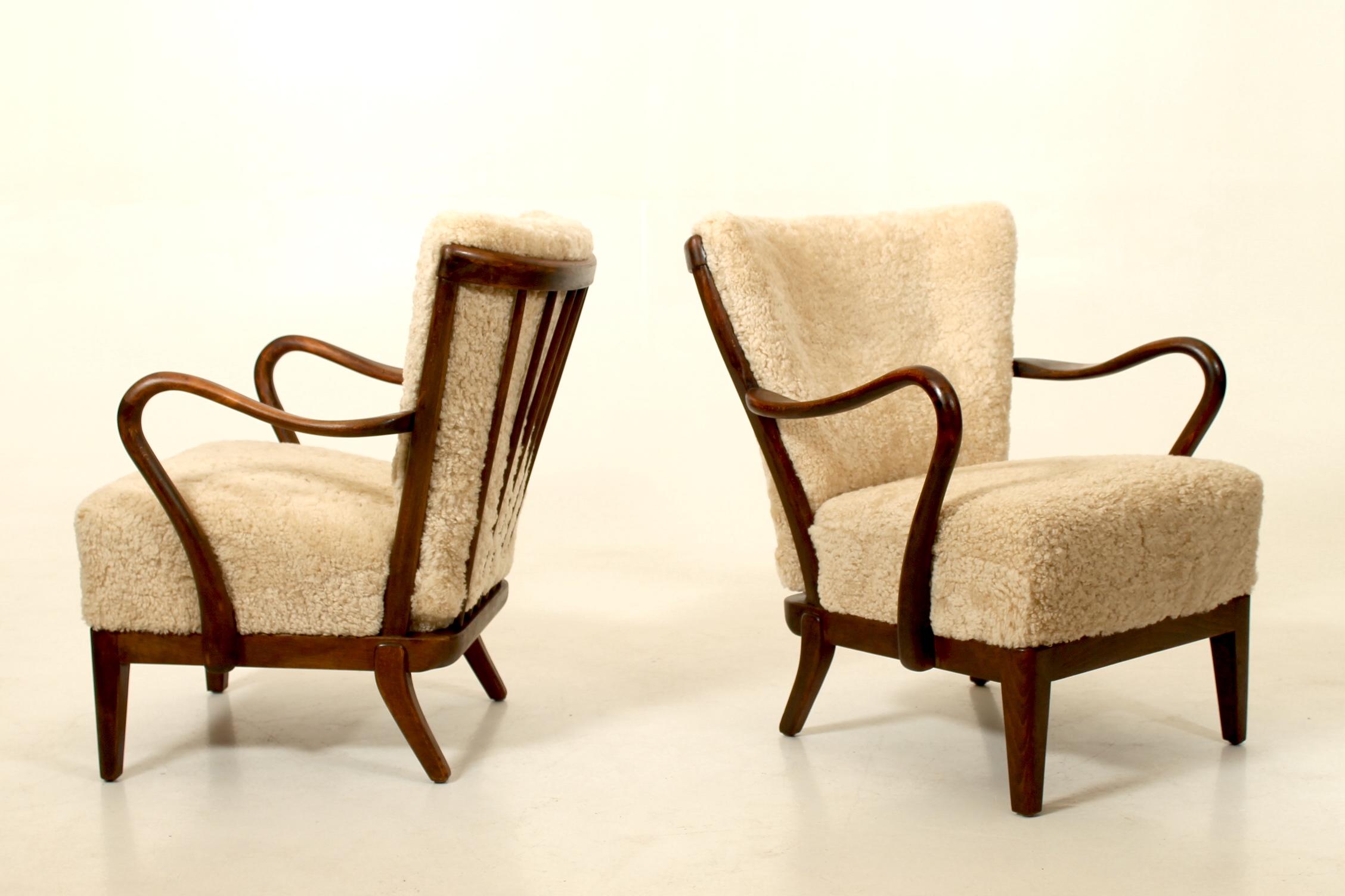 Scandinavian Modern Pair of 1940s lounge chairs by Alfred Christensen, Denmark.