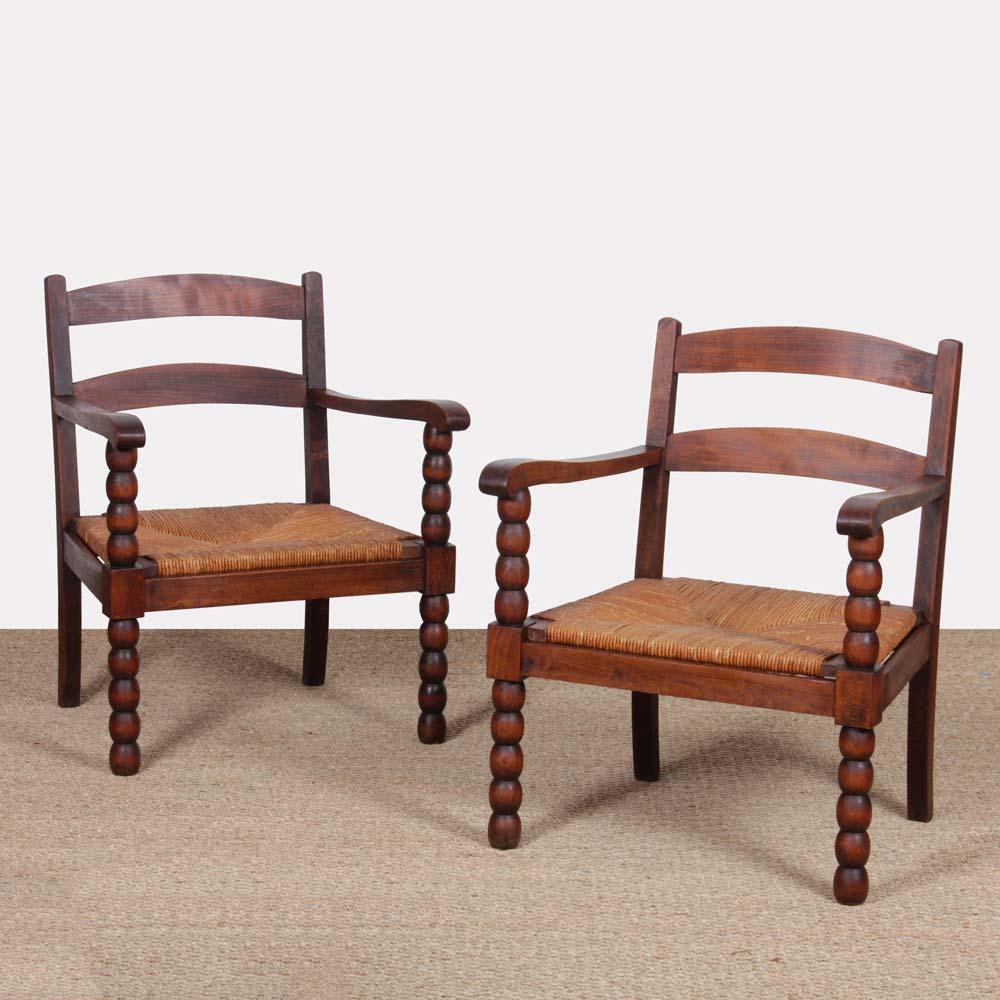 This pair of armchairs is in oak and straw. French work dating from the 1940s. It is in good original condition. 
