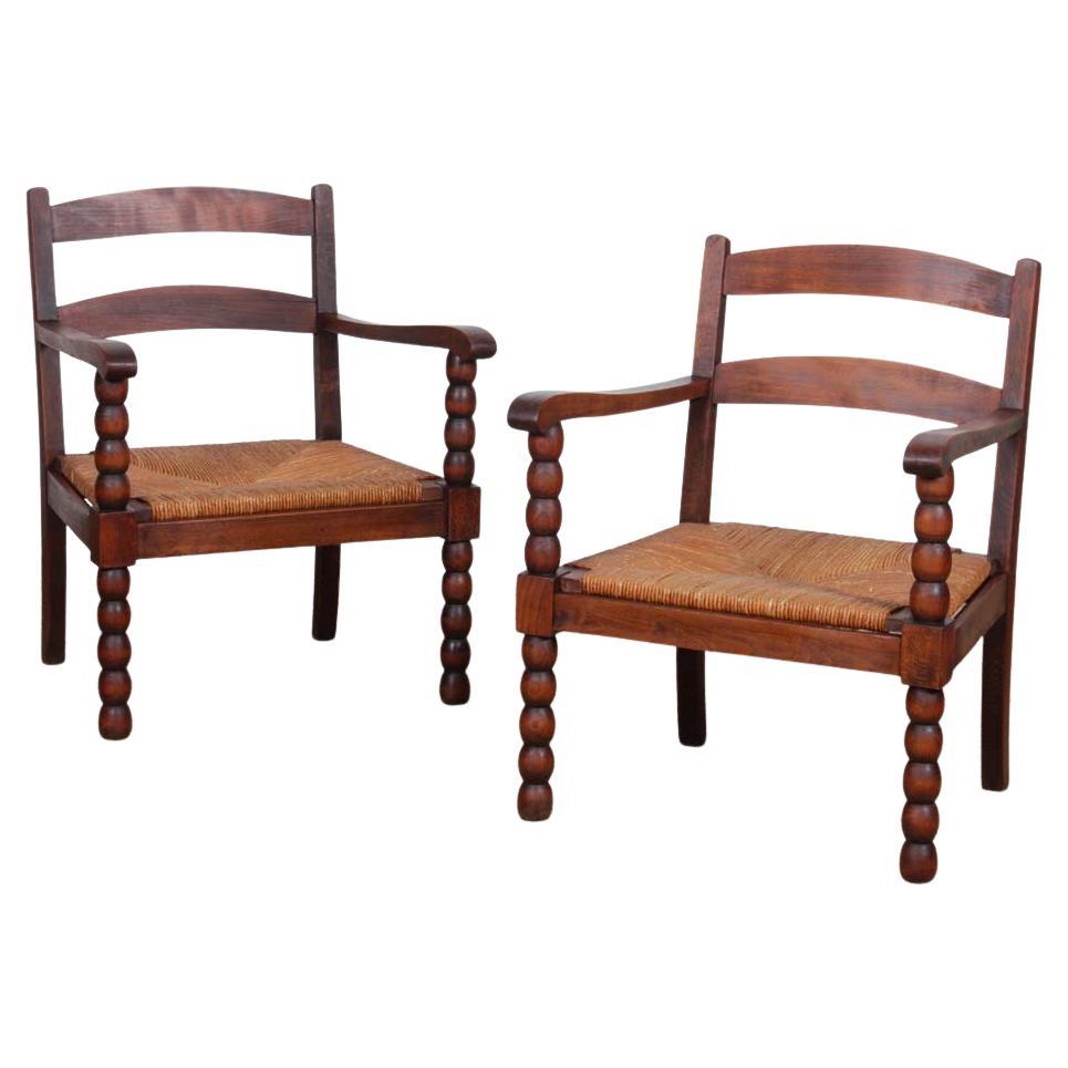 Pair of 1940s oak and straw armchairs en vente