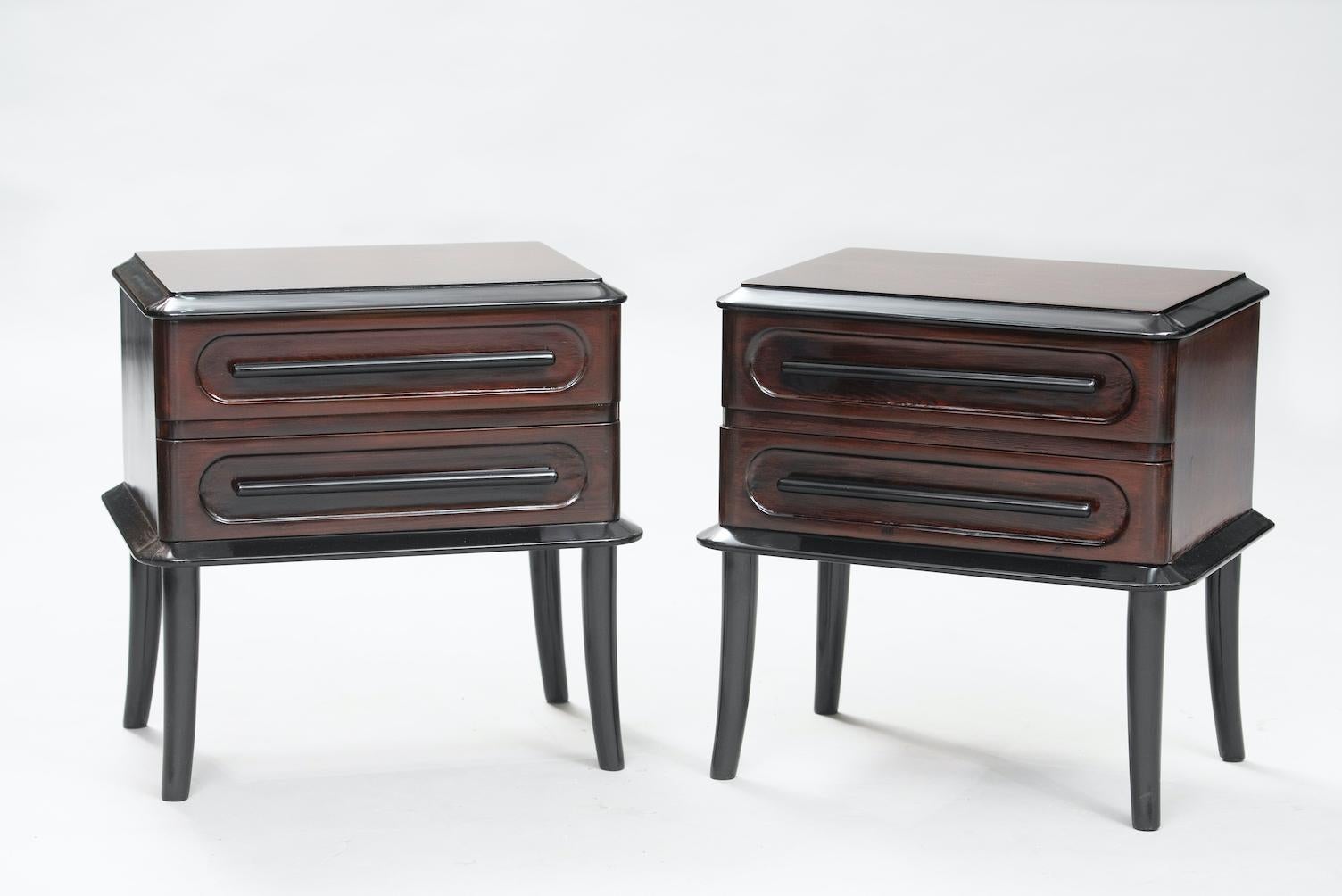 Set of two 1940s Scandinavian birch night stands, with ebonized legs and drawers handles, the birch it self was darkened in a warm rich color.