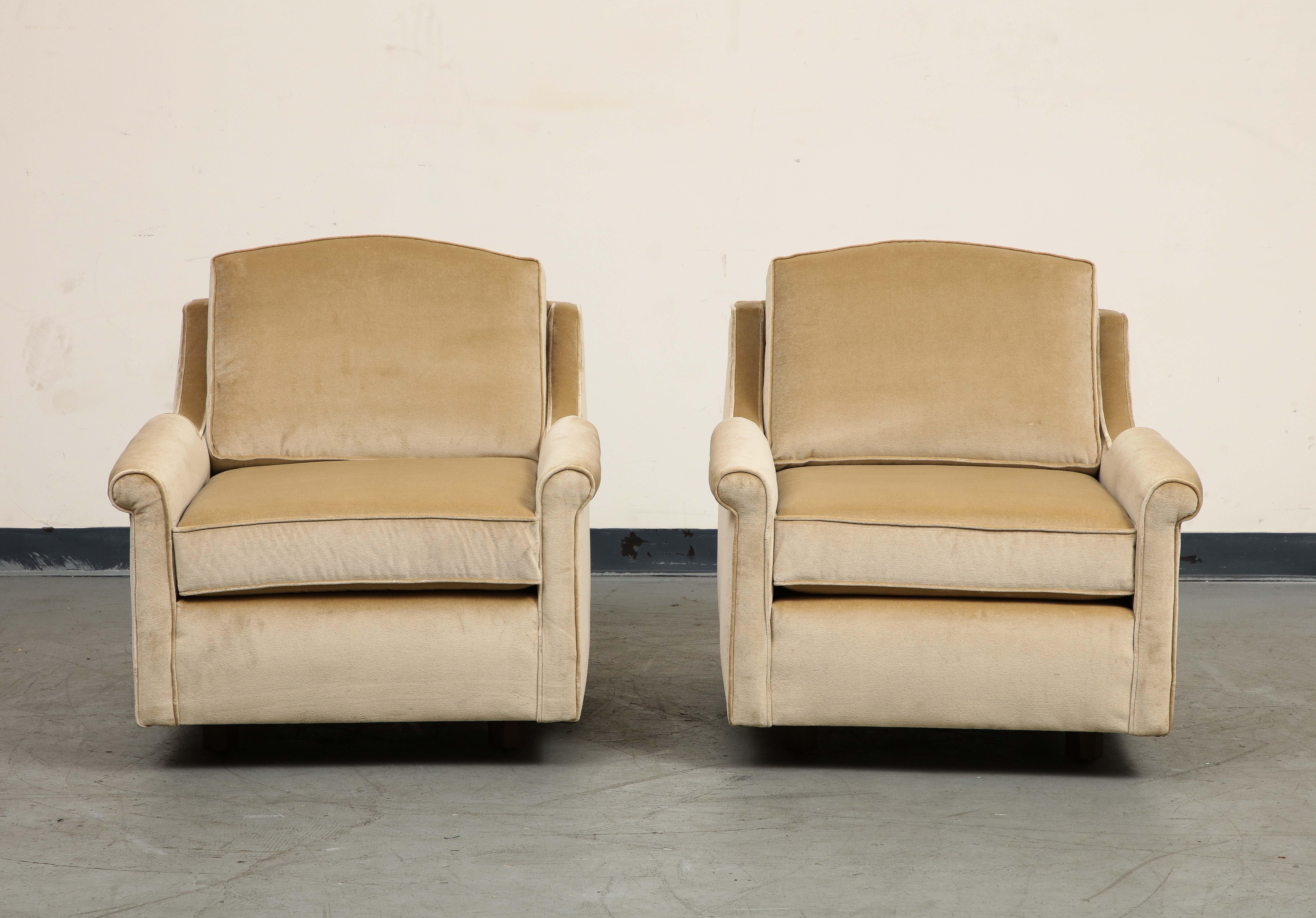 Graceful pair of 1940s Club Chairs, newly upholstered in tan velvet and not used since. Minimalist wood feet. Rolled arms, generous depth and pitch, welting detail. 

Additional Dimensions: 
Seat: 17