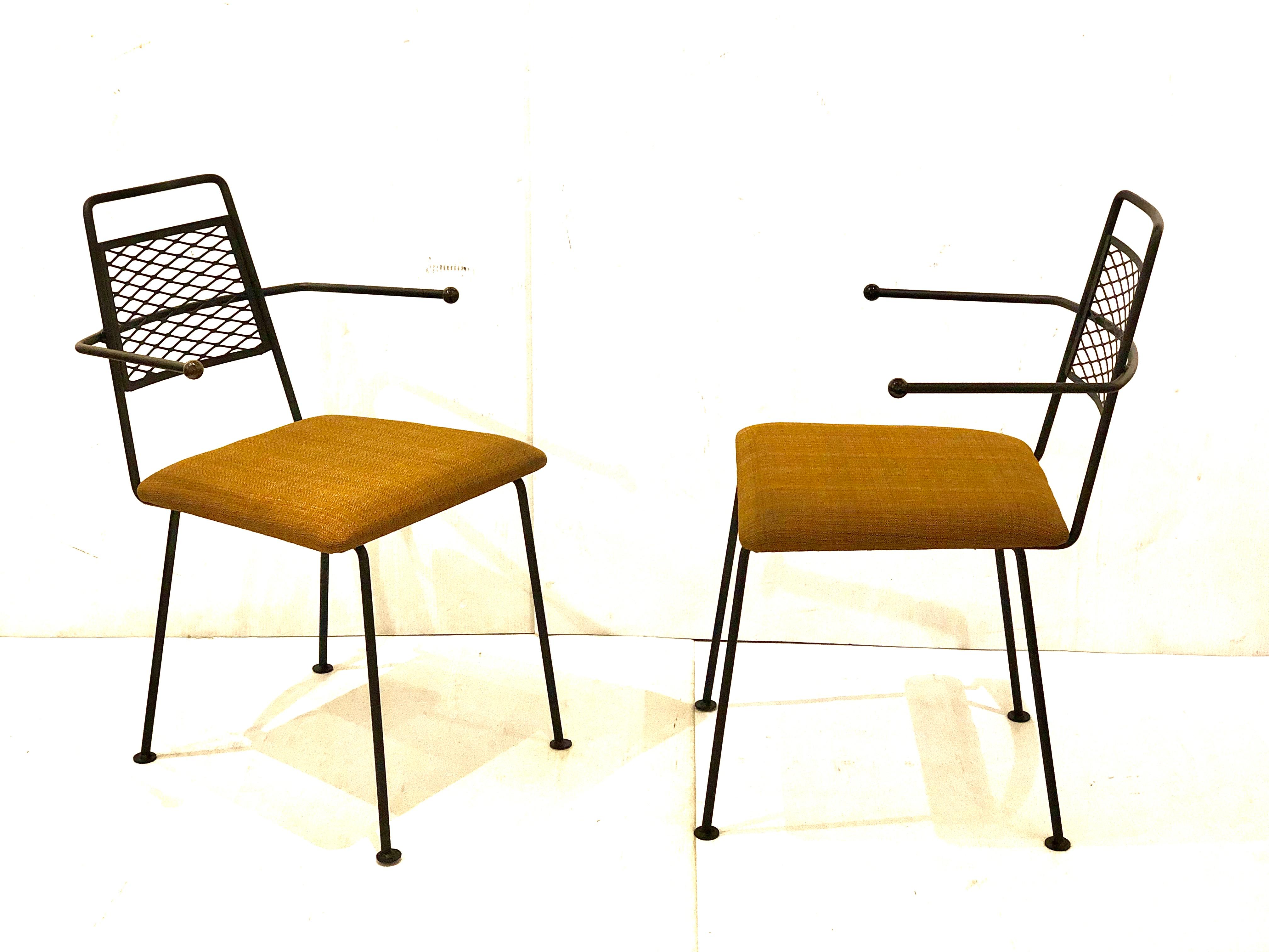 Nice pair solid wrought iron, with freshly upholstered seat pads in brown simple elegant design, hard to find circa 1950s Atomic age look. With ball tips accents at the arms ends freshly resprayed in flat black.