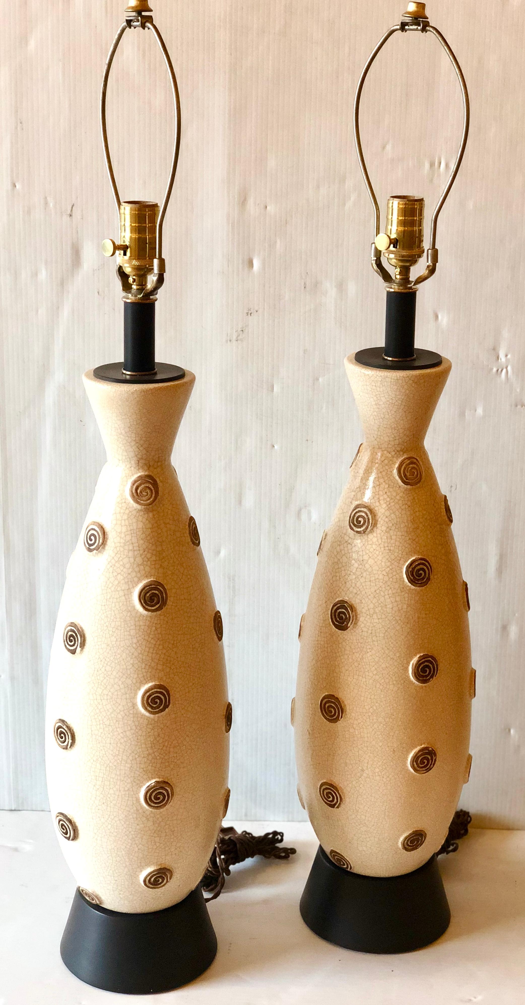 Beautiful pair of tall ceramic tall lamps freshly rewired, lamp shades not included, great condition cleaned and refurbished these pair looks great, circa 1950s. These lamps are 35