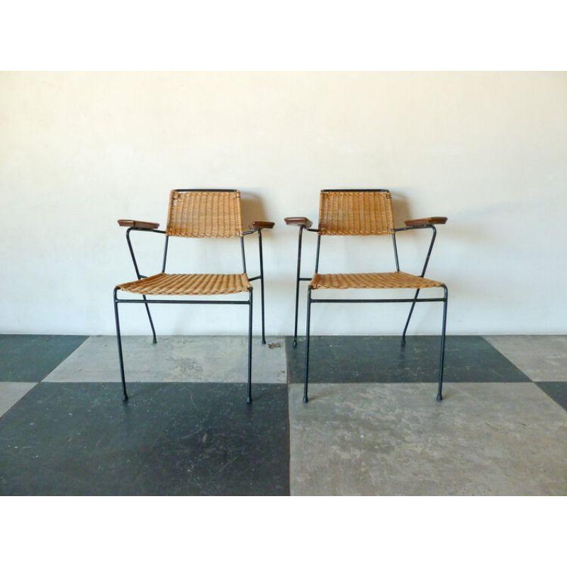 Pair of 1950s Armchairs in Black Metal and Rattan seat with wooden arms. 

In Good Vintage Condition

Dimensions: 21”D x 29”H x 25”W, Seat: 17.5”H