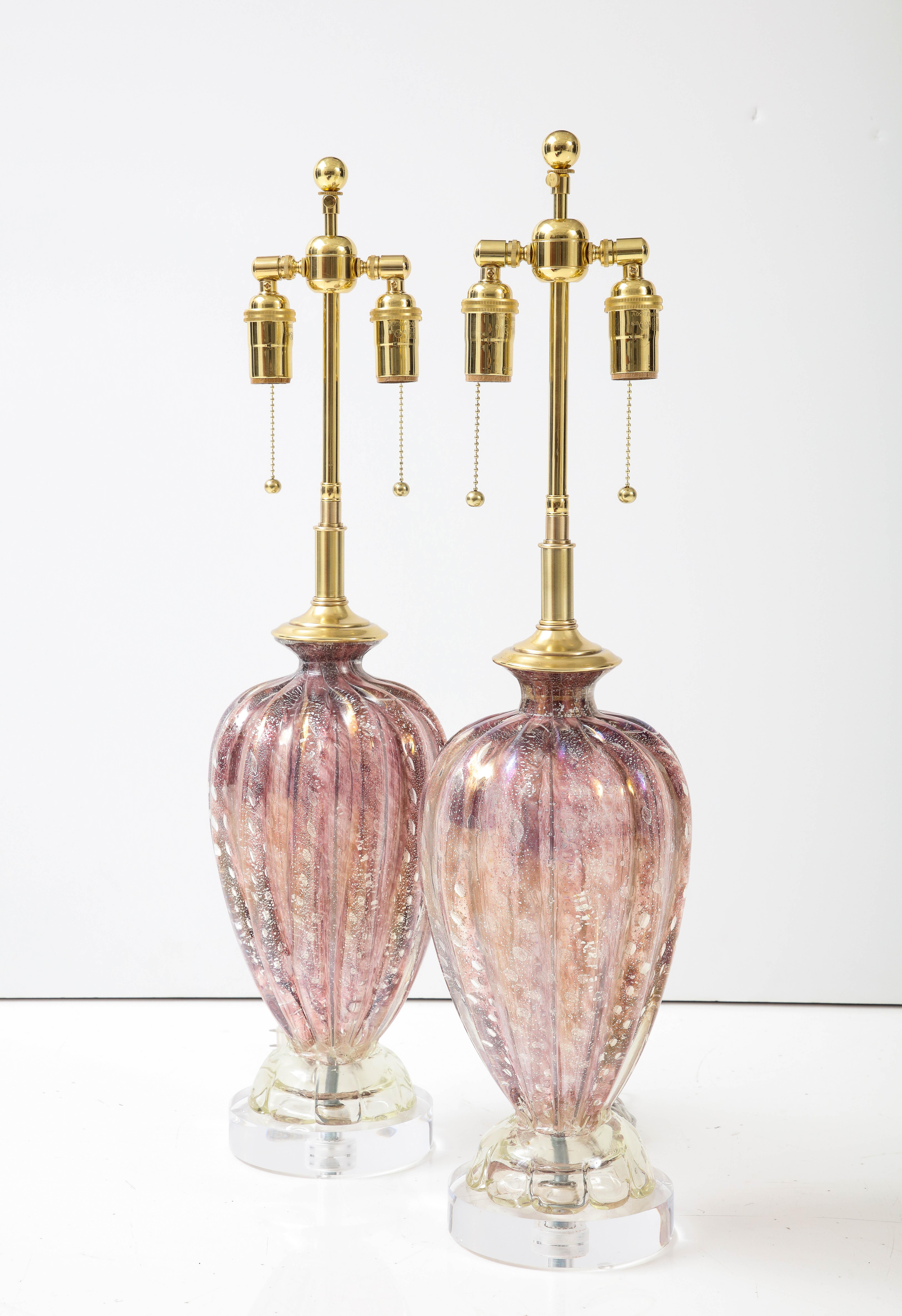 Pair of 1950's Murano glass lamps by Barovier & Toso.
The Beautiful Mauve / Purple Murano glass Lampo bodies have
controlled bubbles with Silvery Gold inclusions and sit on thick
lucite bases.
The lamps have been Newly rewired with adjustable