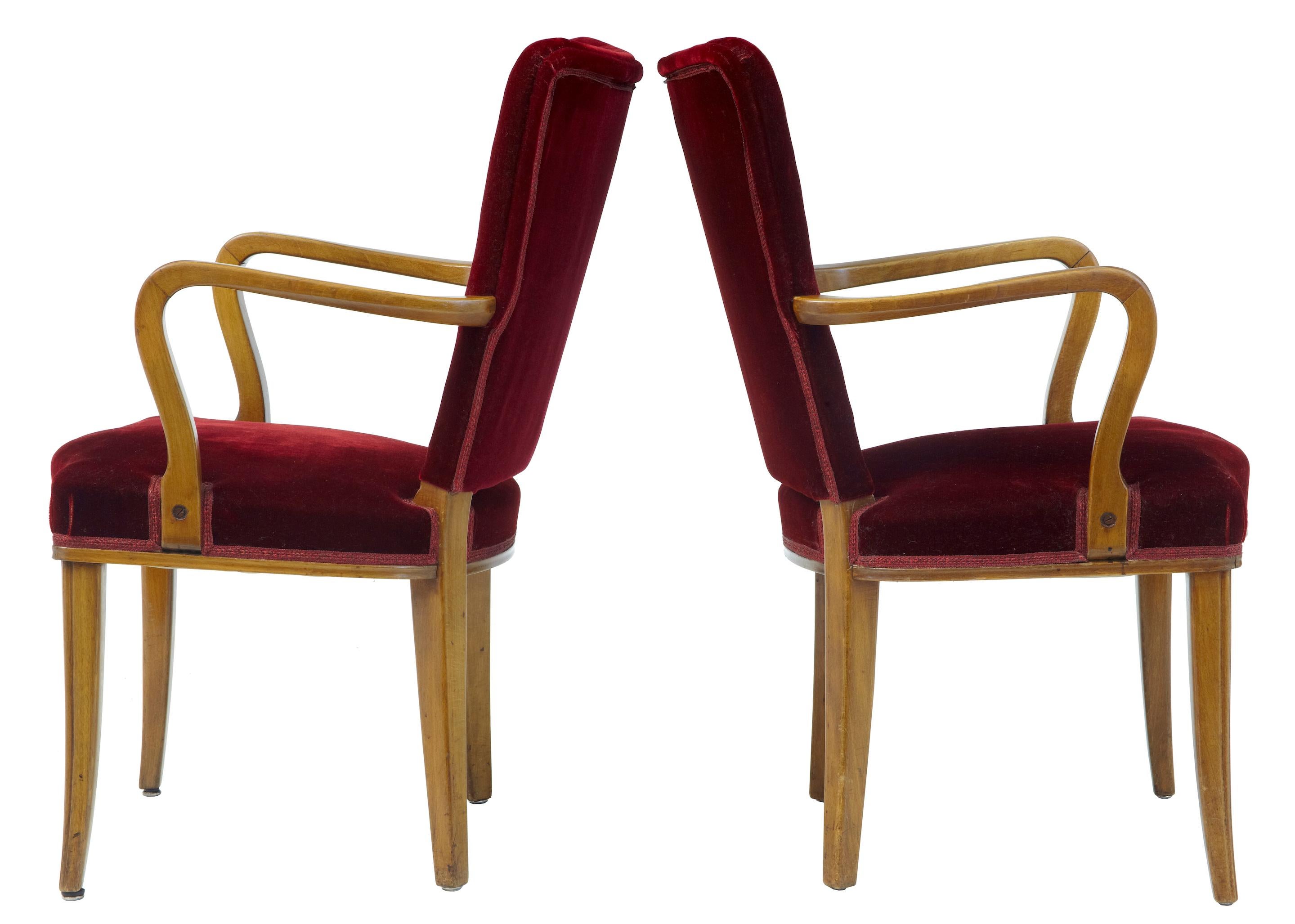 Pair of Scandinavian club armchairs, circa 1950.
Open birch arm, richly upholstered in red velvet. Some minor wear to velvet but in good usable condition.

Measure: Height 35