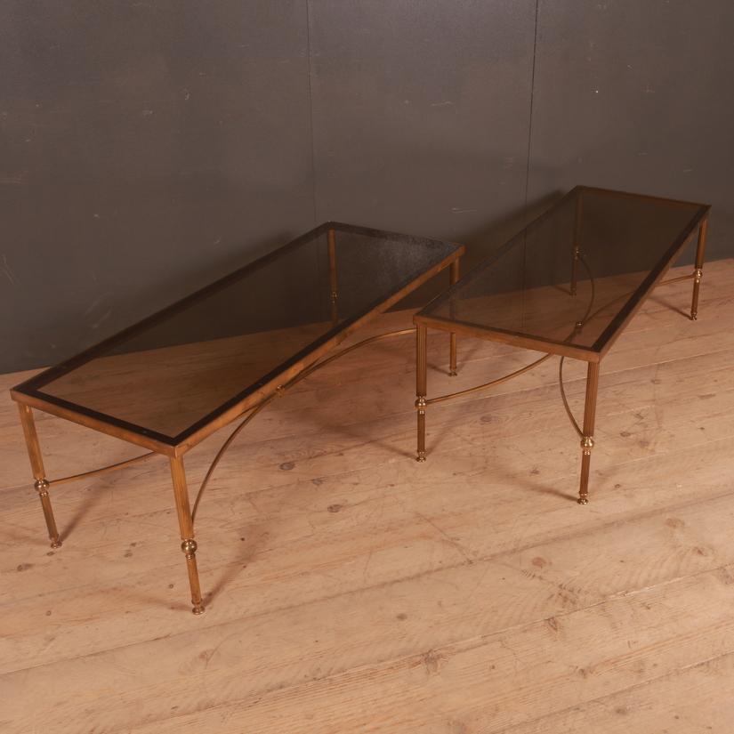 Pair of 1950s French brass and glass low table, 1950.


Dimensions:
47.5 inches (121 cms) wide
18 inches (46 cms) deep
16 inches (41 cms) high.
 