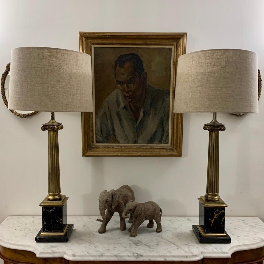 Really lovely pair of brass corinthian column lamps on beautiful black marble bases and further black marble plinths, by Stiffel.
The brass itself has aged beautifully and I have not over polished it, so leaving all that fabulous patina and age as