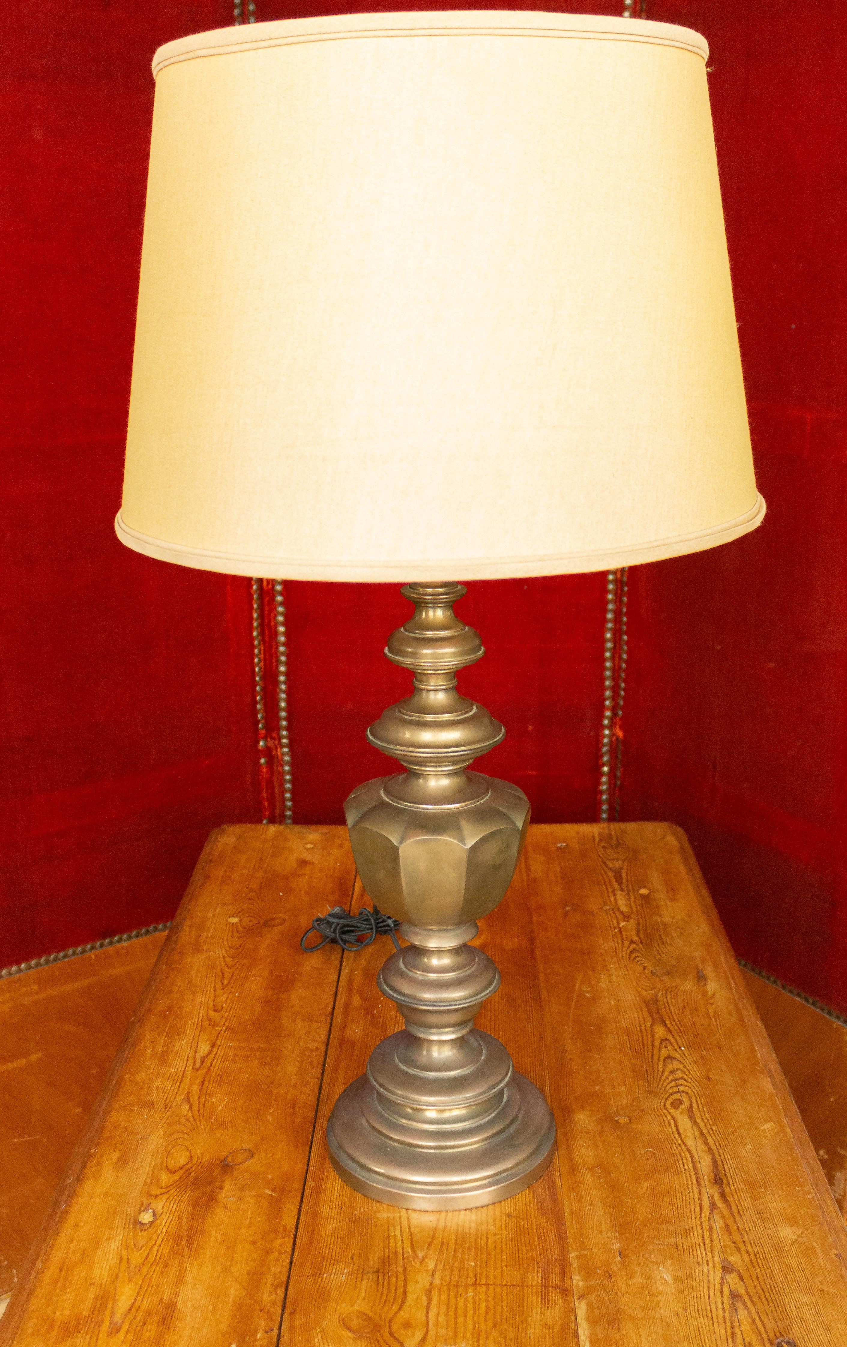 Elegant pair of American lamps with an English brass finish. Not sold with shades