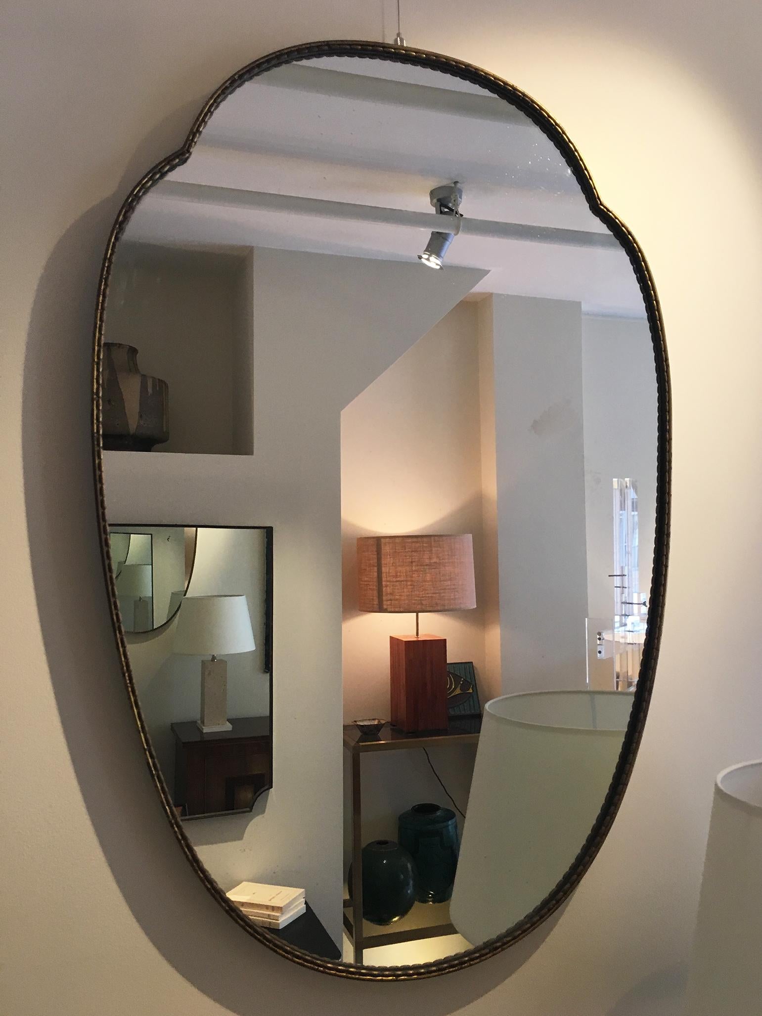 Mid-Century Modern Pair of 1950s Brass Shield Shaped Mirrors, Italy