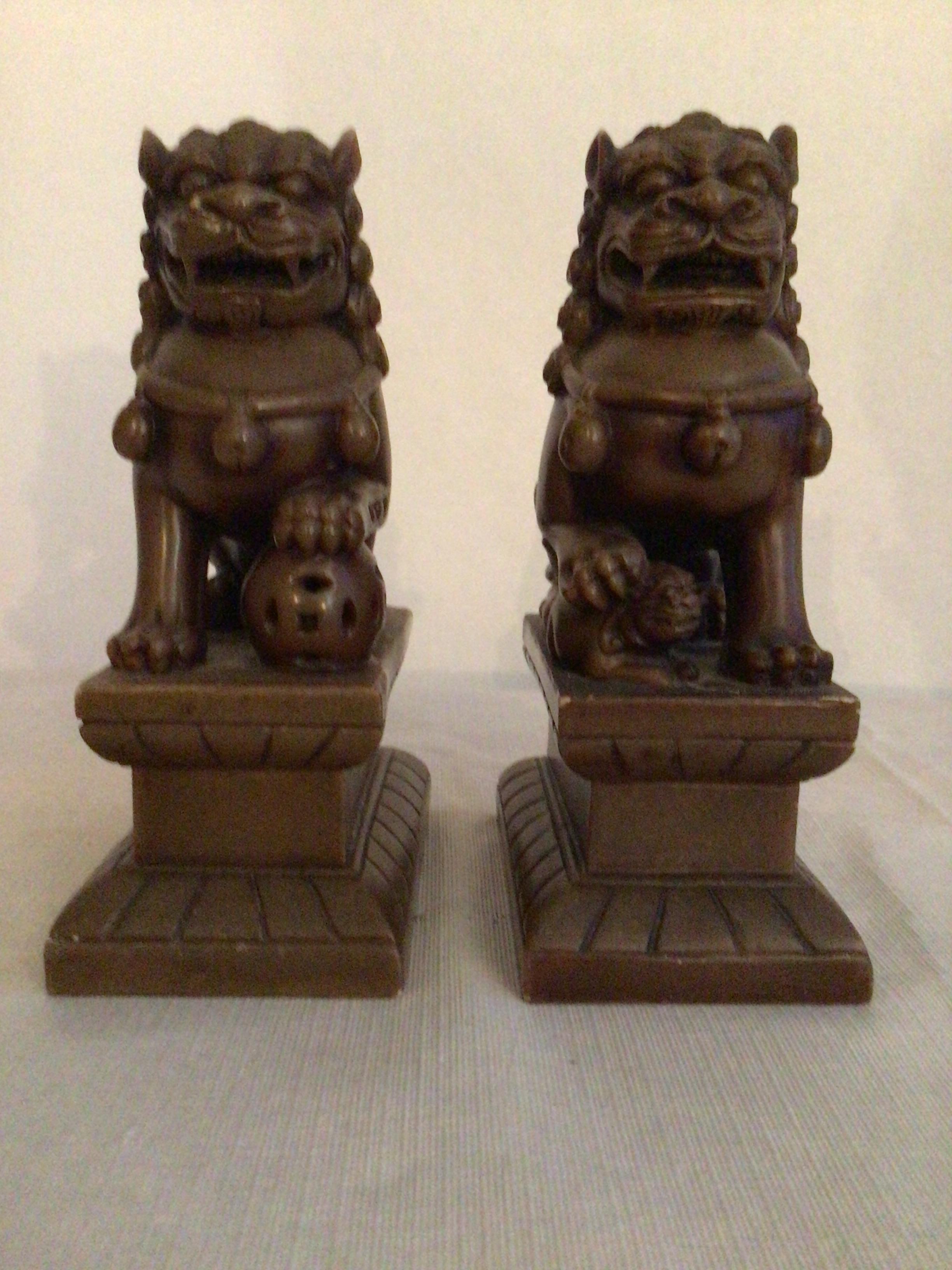Pair of 1950s carved soapstone Foo dogs each one uniquely different.