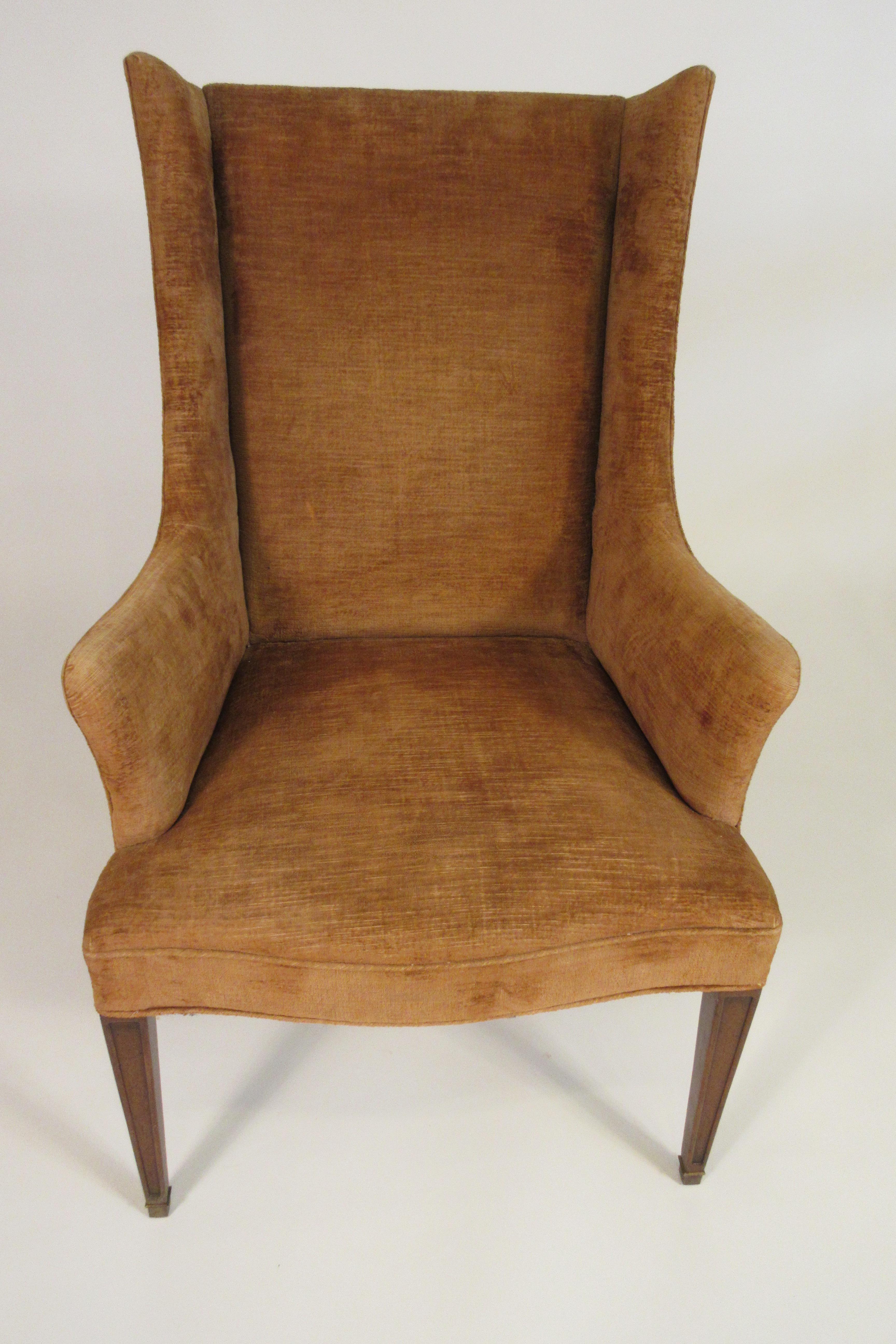 Pair of 1950s wingback chairs. Needs re-upholstery. Wood needs refinishing.