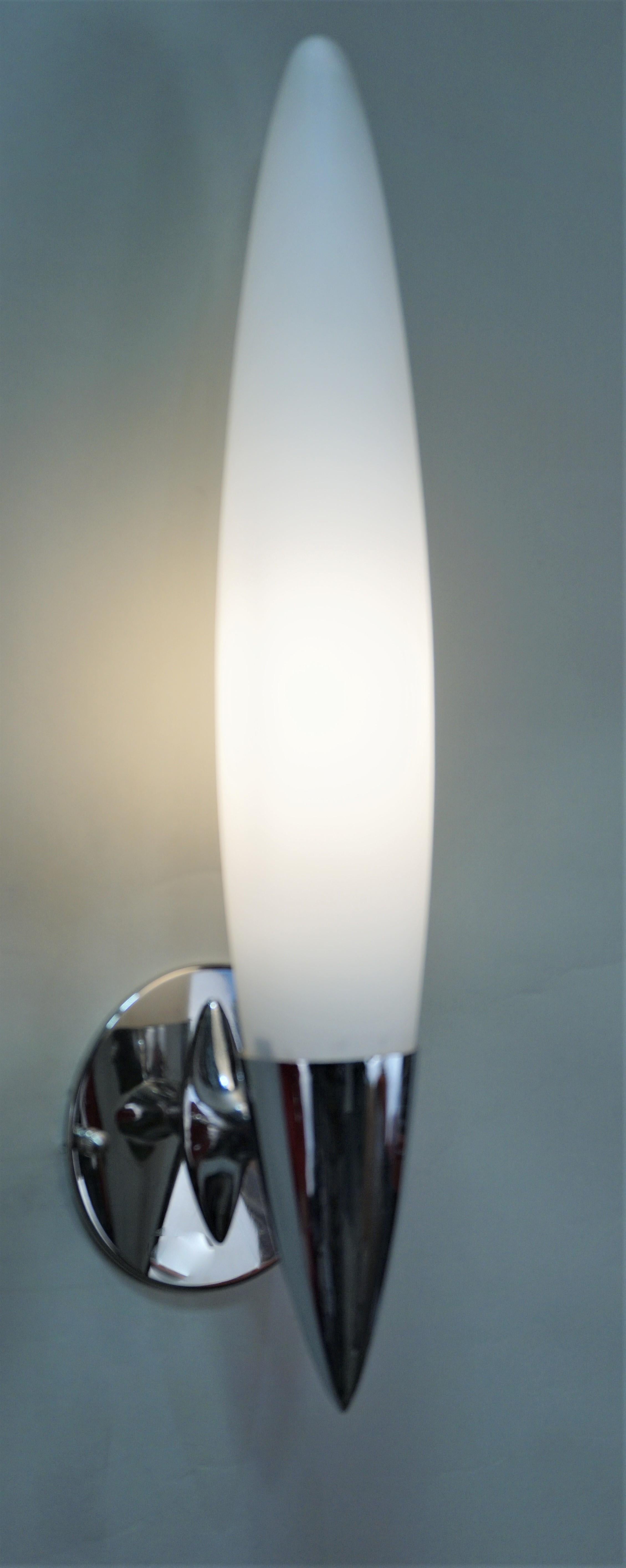 Simple design but very elegant, pair of chrome and opal glass wall sconces.
Measures: Back plate is 4.5