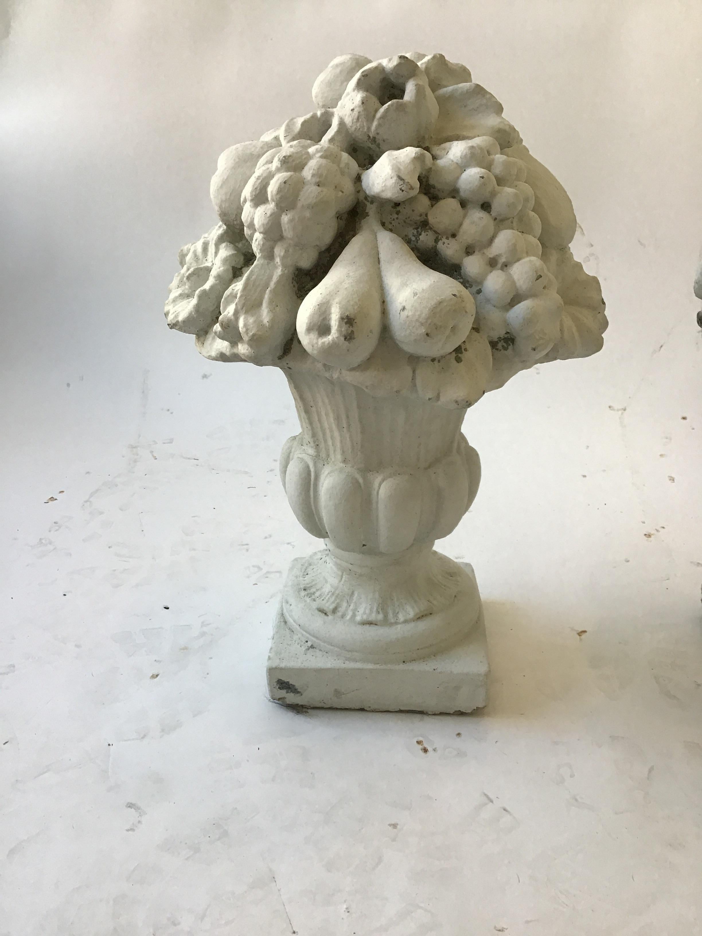 Pair of 1950s concrete urns with fruit.