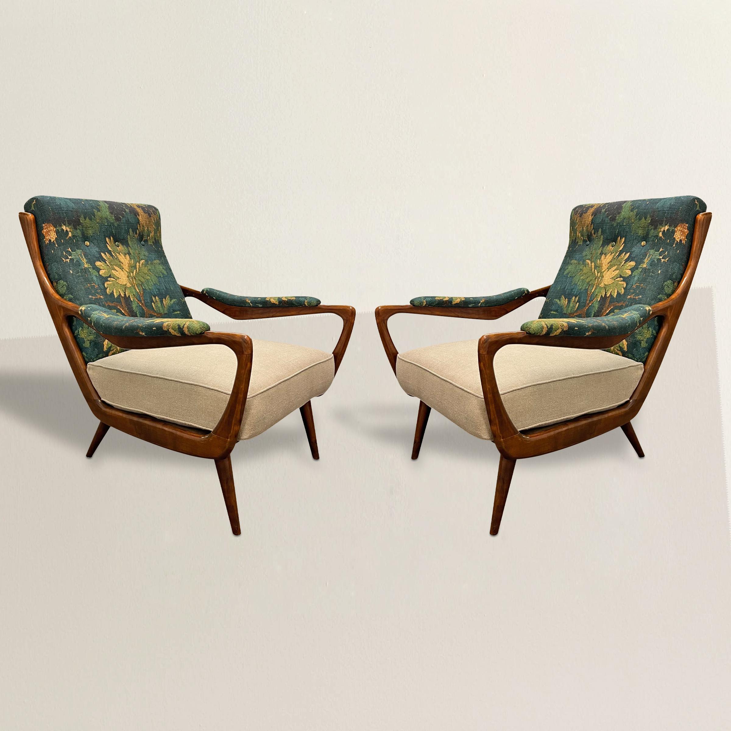 Elevate your interior with this pair of 1950s Danish Modern lounge chairs, a harmonious blend of mid-century elegance and contemporary style. The chic wood frames, emblematic of Danish Modern design, exemplify the movement's emphasis on natural