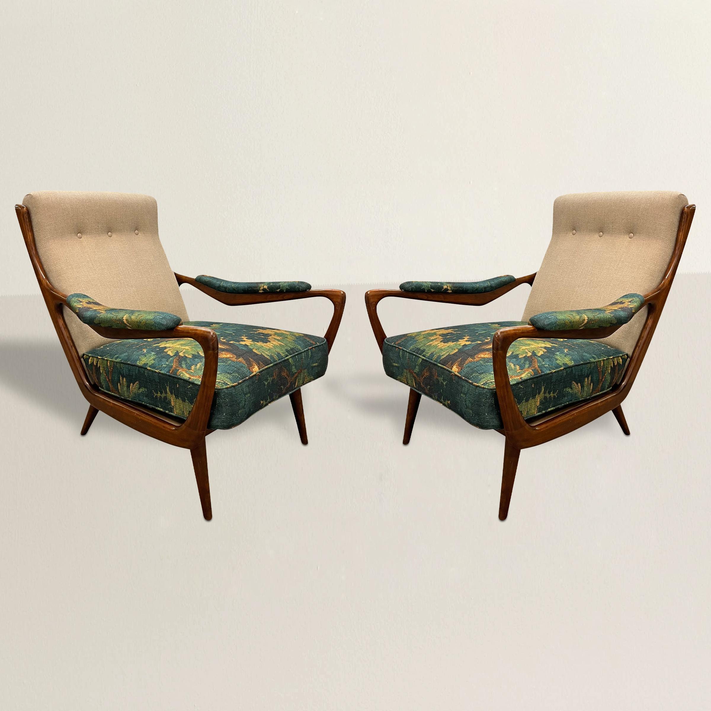 Elevate your interior with this pair of 1950s Danish Modern lounge chairs, a harmonious blend of mid-century elegance and contemporary style. The chic wood frames, emblematic of Danish Modern design, exemplify the movement's emphasis on natural