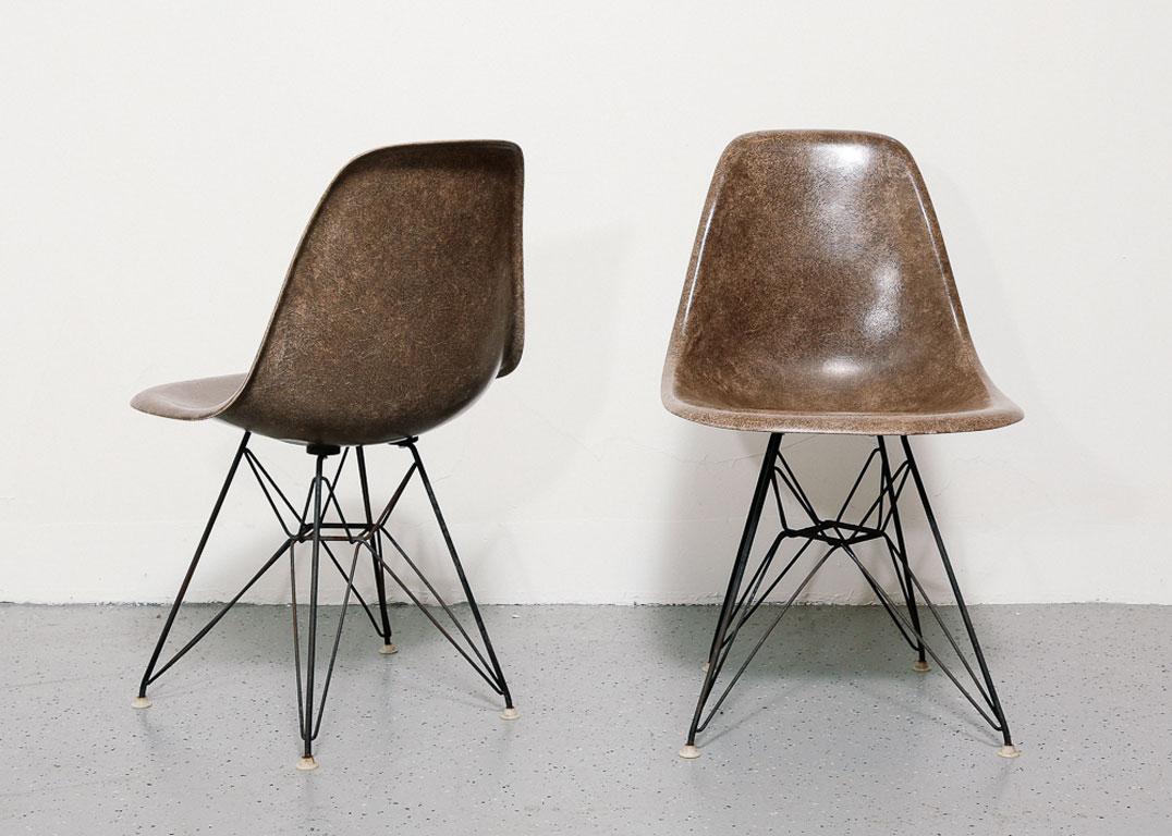 Fantastic pair of 1950s Eames DSR chairs for Herman Miller.

Rare dark tan colored fiberglass shells on a metal Eiffel base.