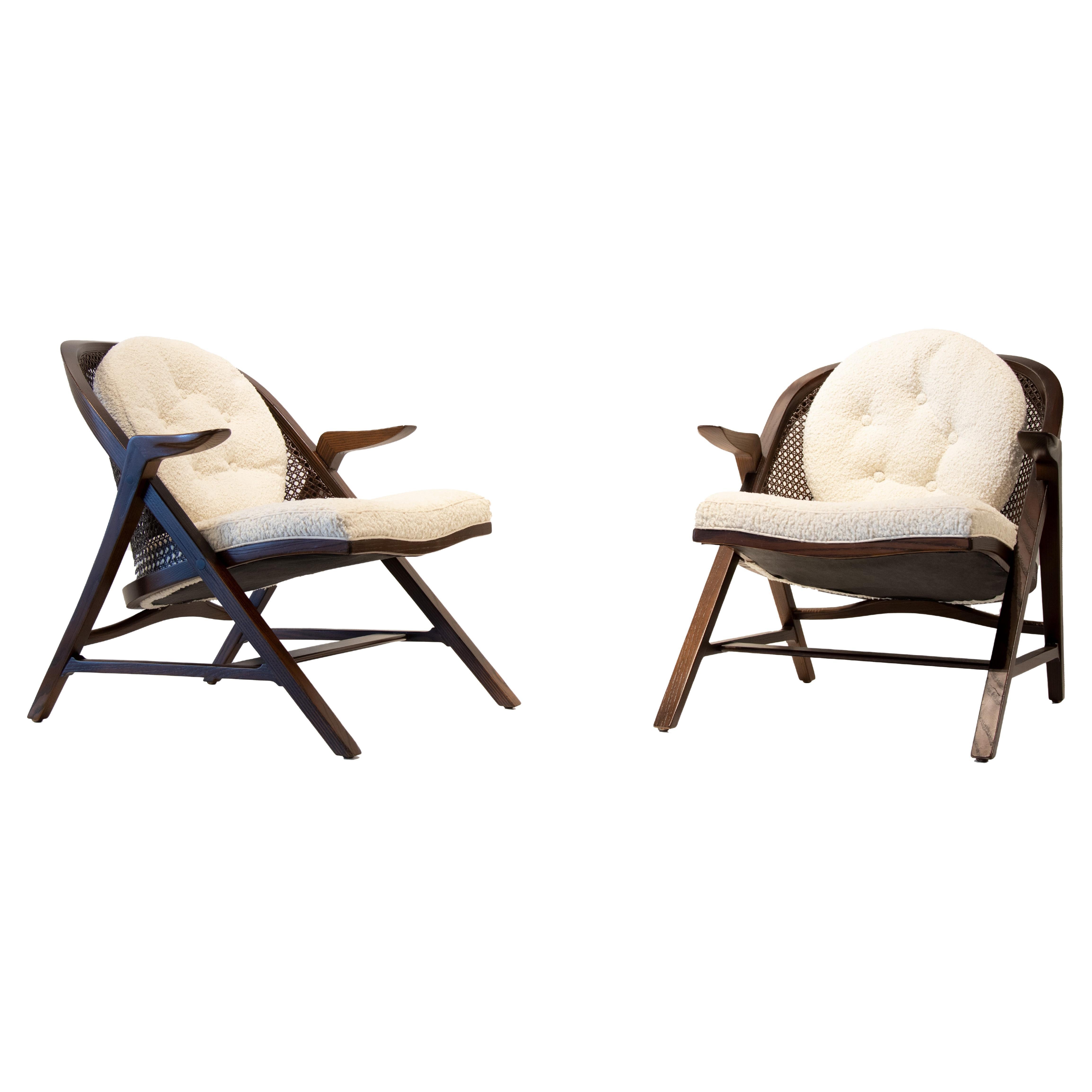 Pair of 1950s Edward Wormley for Dunbar Cane back chairs model 5700a. The continuous laminated ash legs wrap around the entire chair and form the swooping arch back. The pressed caning lets the piece breathe and provides interest when viewed from