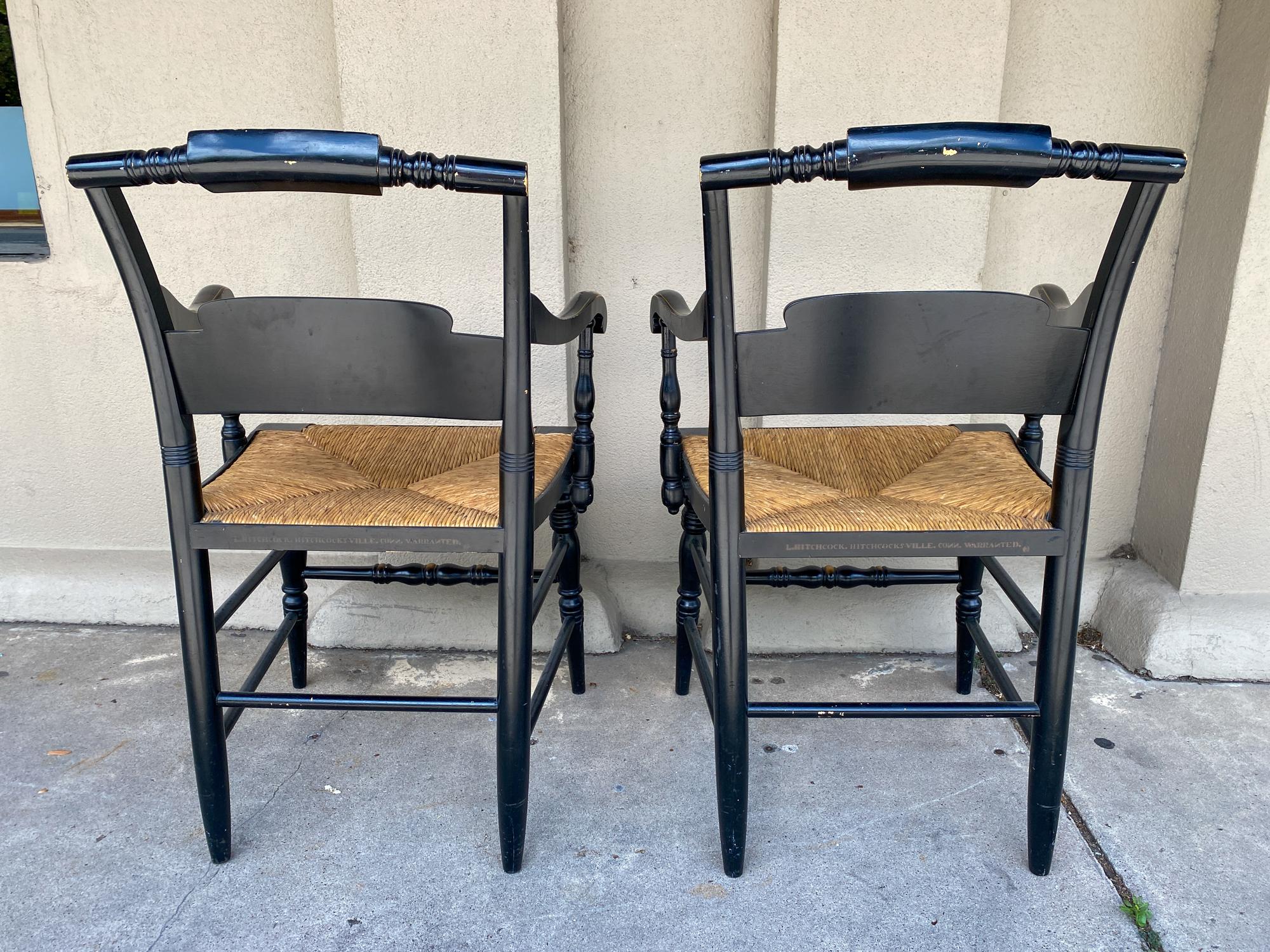 Carved Pair of 1950s English Black and Gold Painted Wood and Rush Seat Armchairs