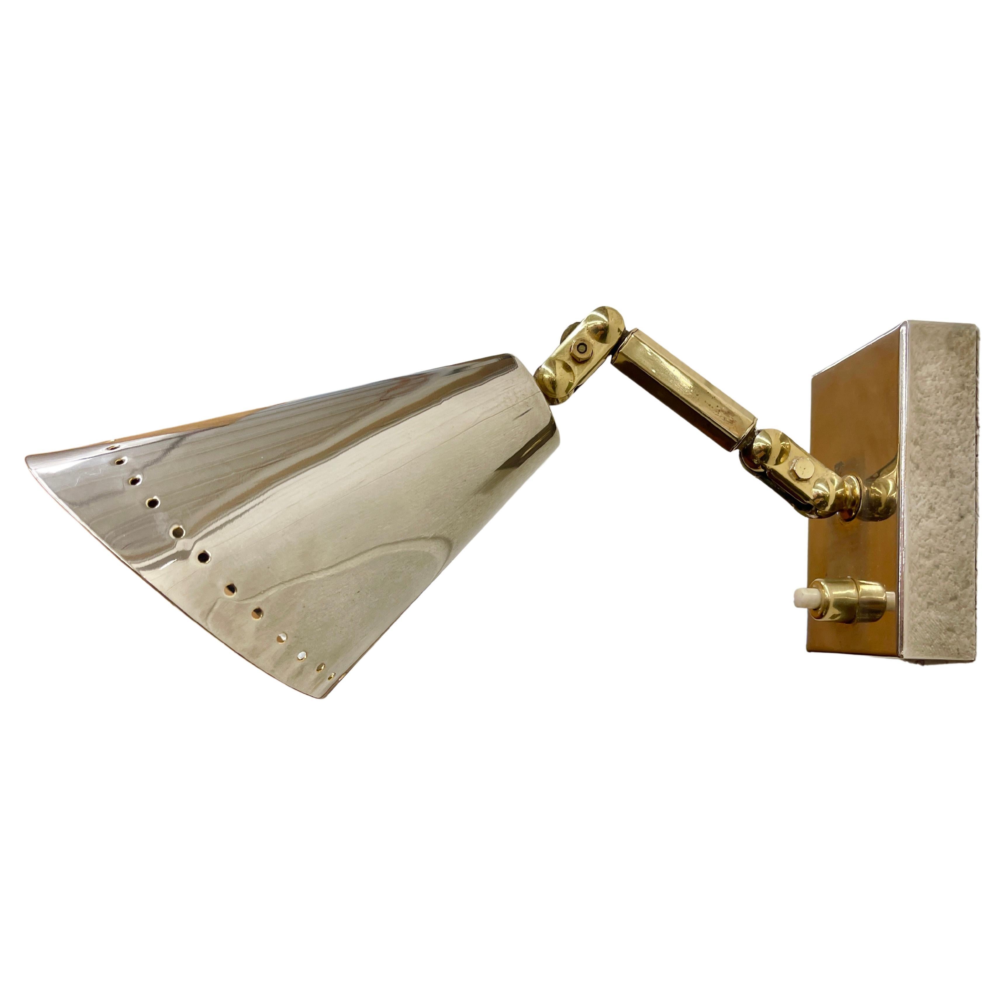 Pair of petite wall-mounted multi-positional sconces from France circa late 1950's. Two tone with polished nickel plated brass perforated cones and mounting box (3.25