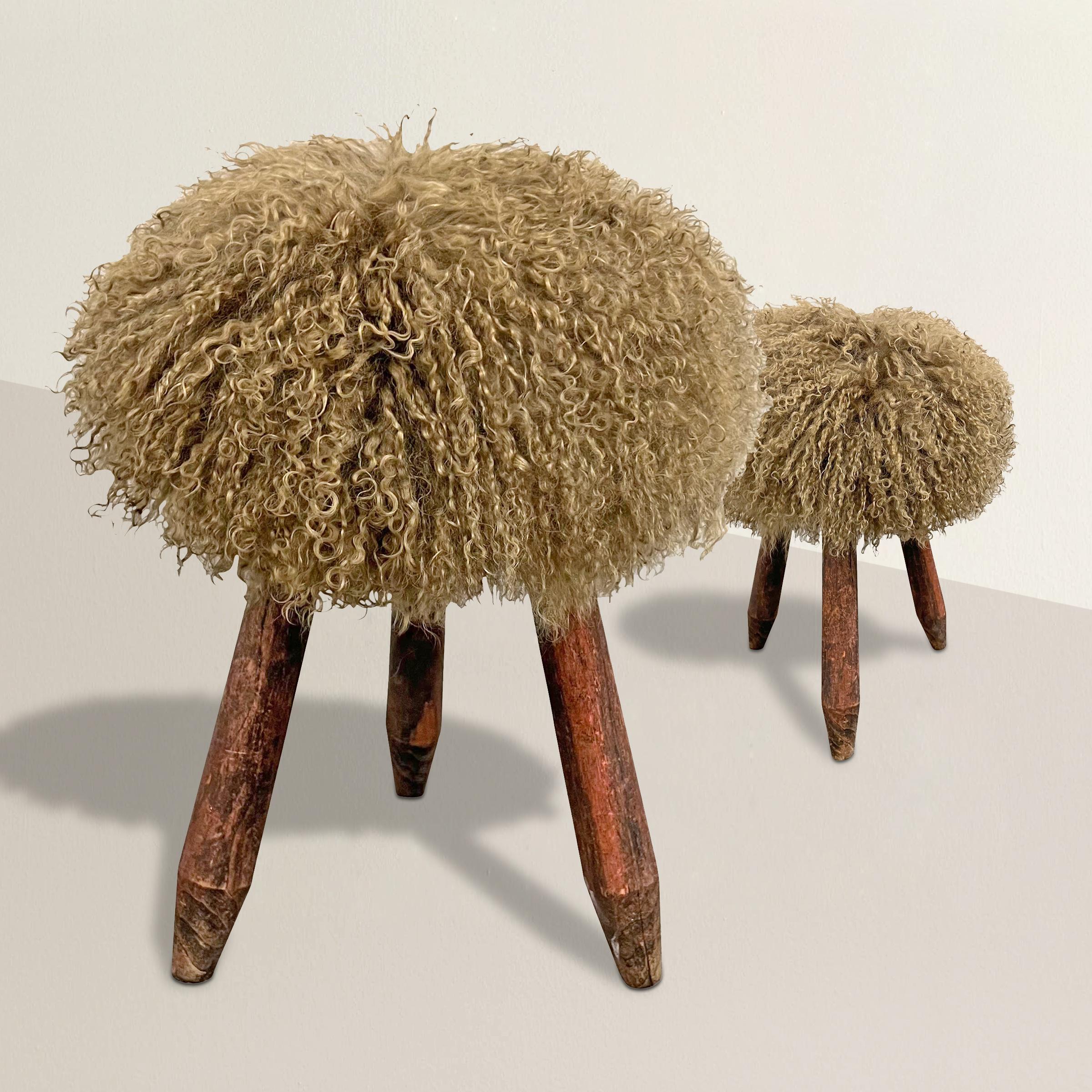 These 1950s French Modernist three-legged stools channels the spirit of design pioneer Charlotte Perriand with their sleek lines and innovative approach. However, they take a contemporary twist with their sumptuous mossy green curly Mongolian sheep