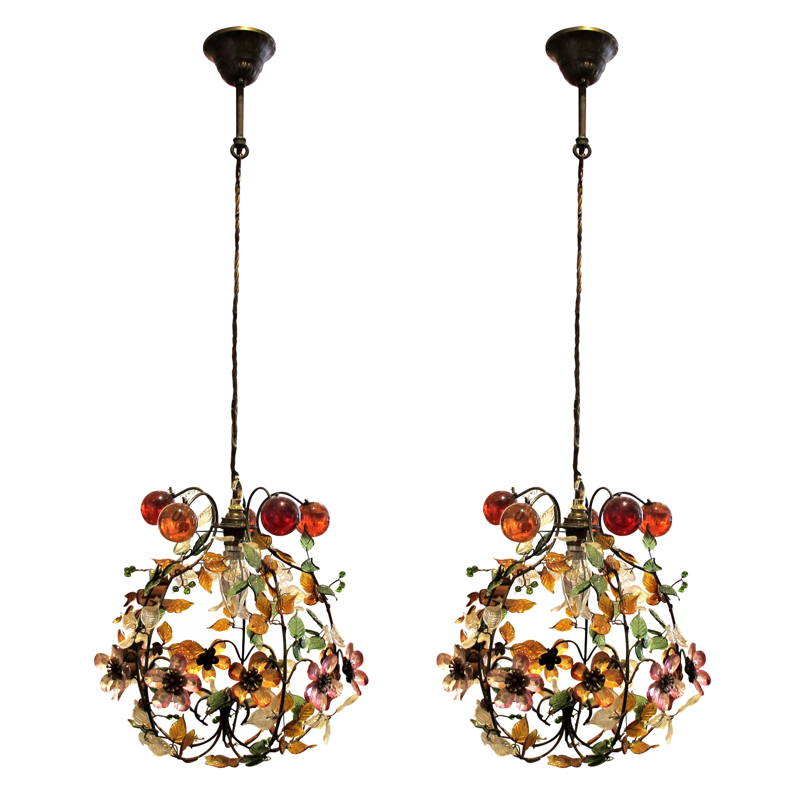 Pair of mid century French highly decorative pendant ceiling lights decorated with multi-coloured glass flowers, leaves and acrylic spheres mounted on a metal frame. The ceiling lights have been rewired to UK standards. Each light is fitted with a