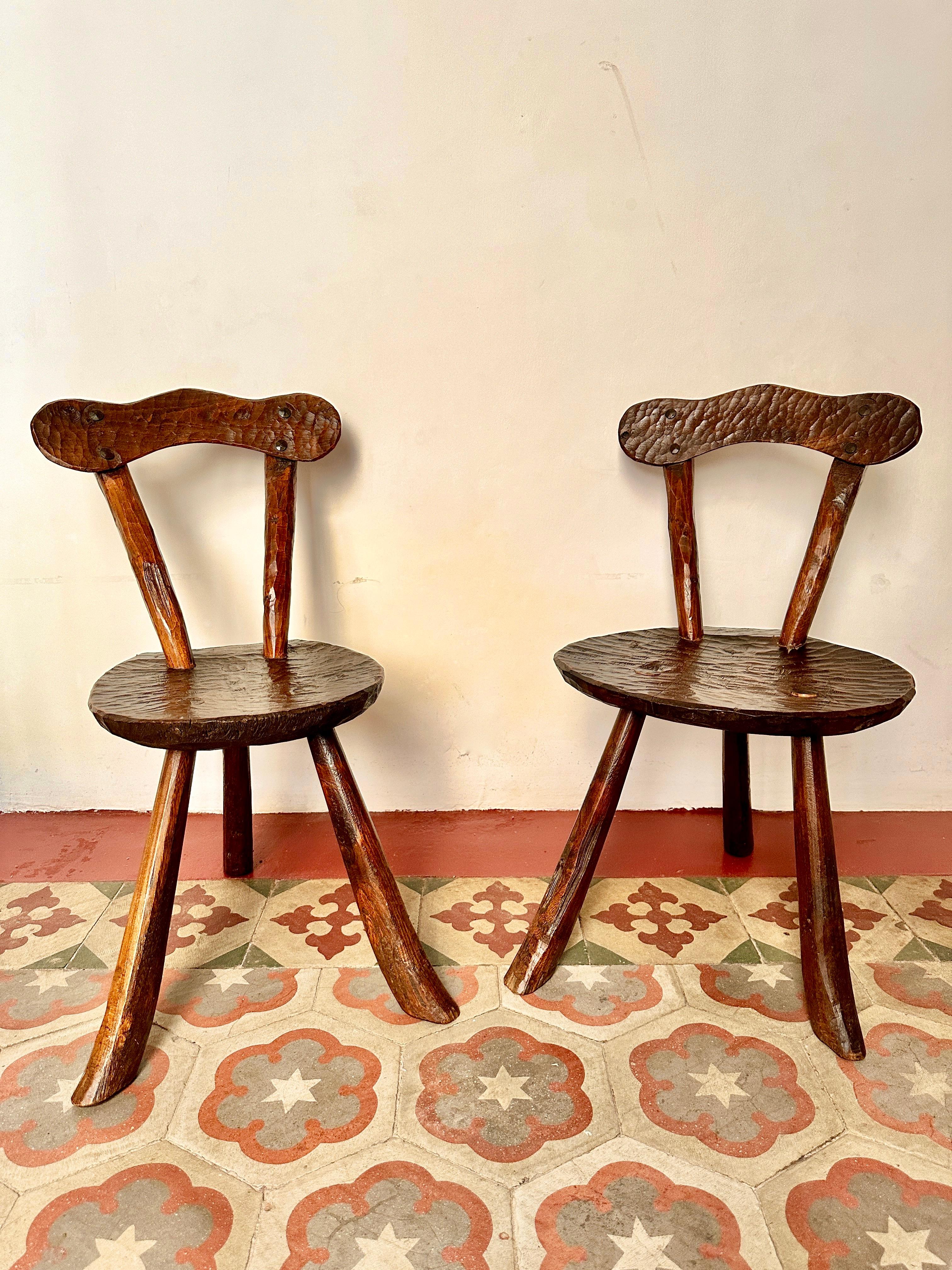 Pair of 1950s French primitive milking stools

Superb and rare hand-carved elm chairs from the Cévennes region. These small brutalist stools are in excellent and solid condition with light, attractive wear.

Height 65cm Width 37cm Depth 48cm Seat