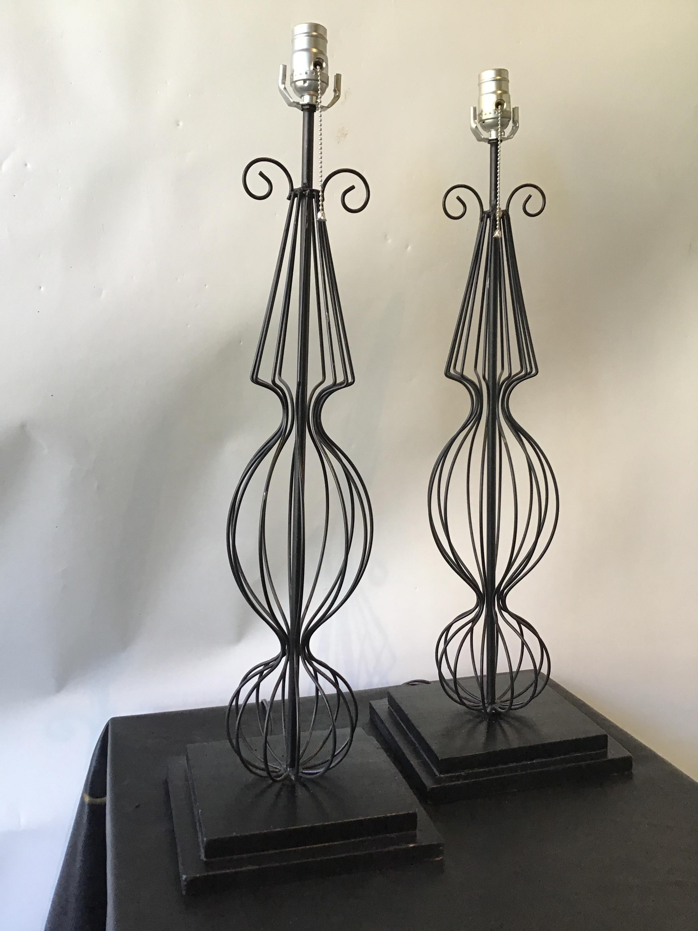 Pair of 1950s French wire lamps on wood bases. Shades included. Out of a Southampton, Ny estate.