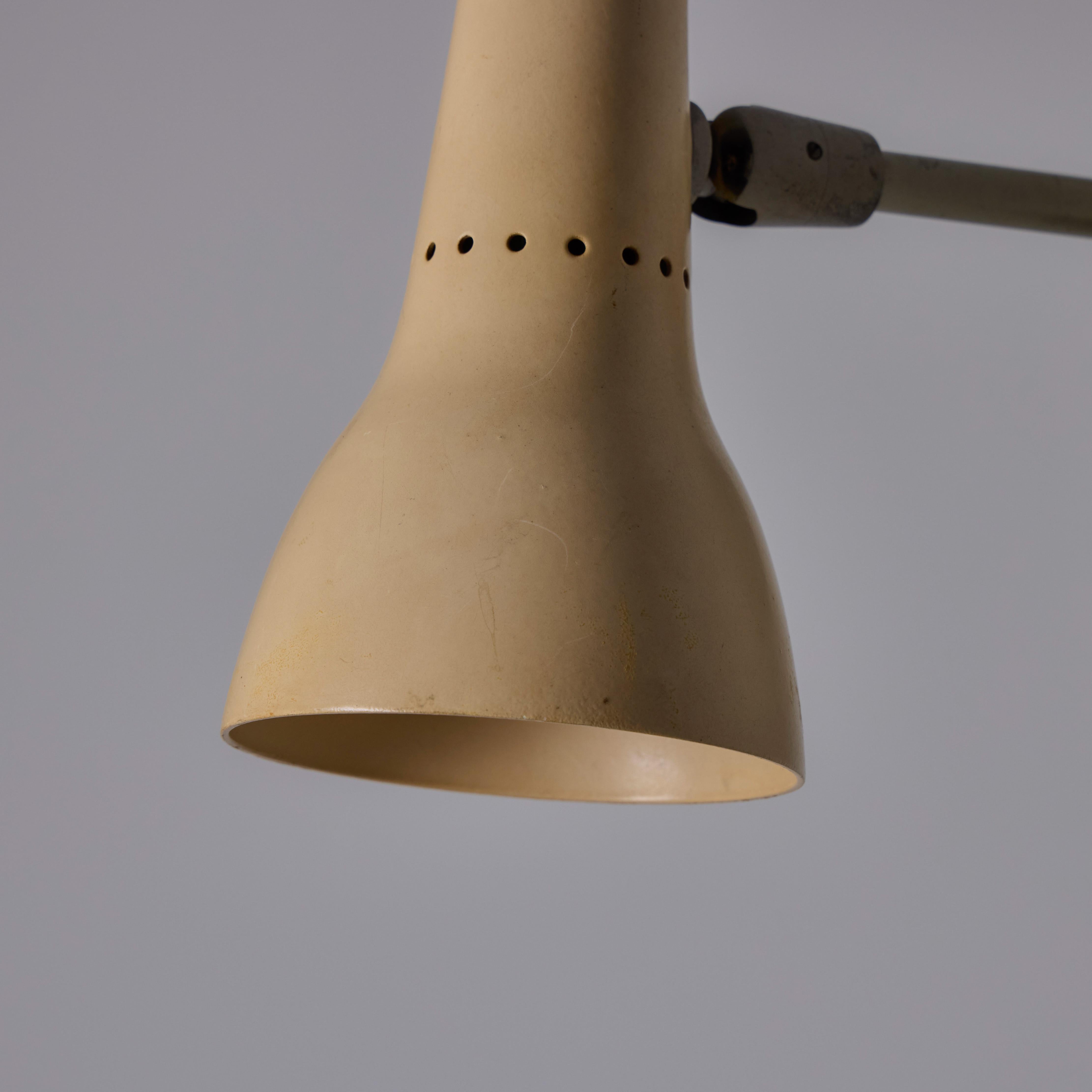 Metal Pair of 1950s Giuseppe Ostuni #109-1 'Tubetto 2 Snodi Piccoli' Sconces for Oluce For Sale