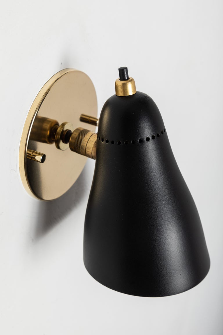 Pair of 1950s Giuseppe Ostuni Black Articulating Sconces for OLuce at 1stDibs