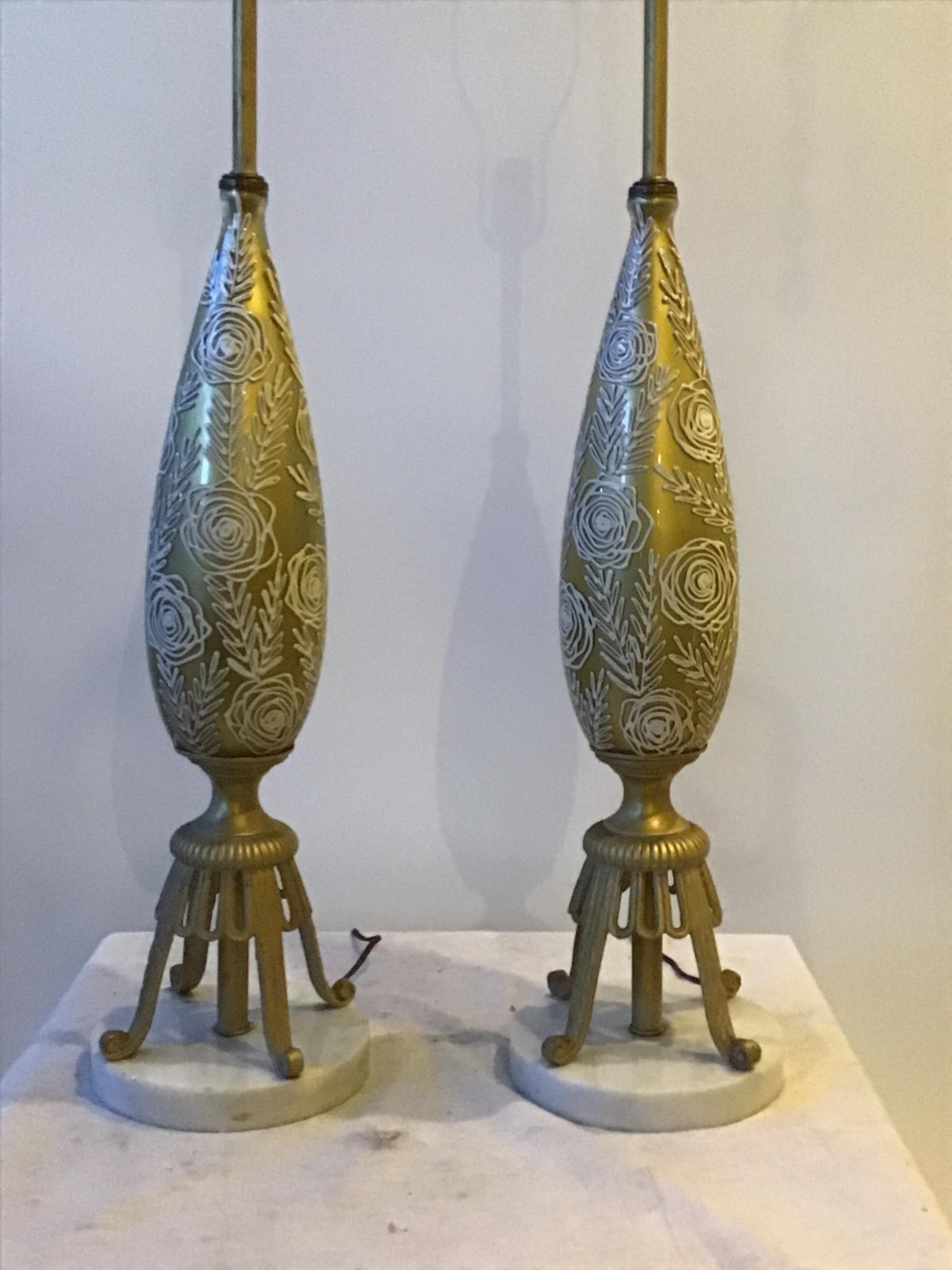 Pair of 1950s gold glass lamps with raised floral design. Marble base.